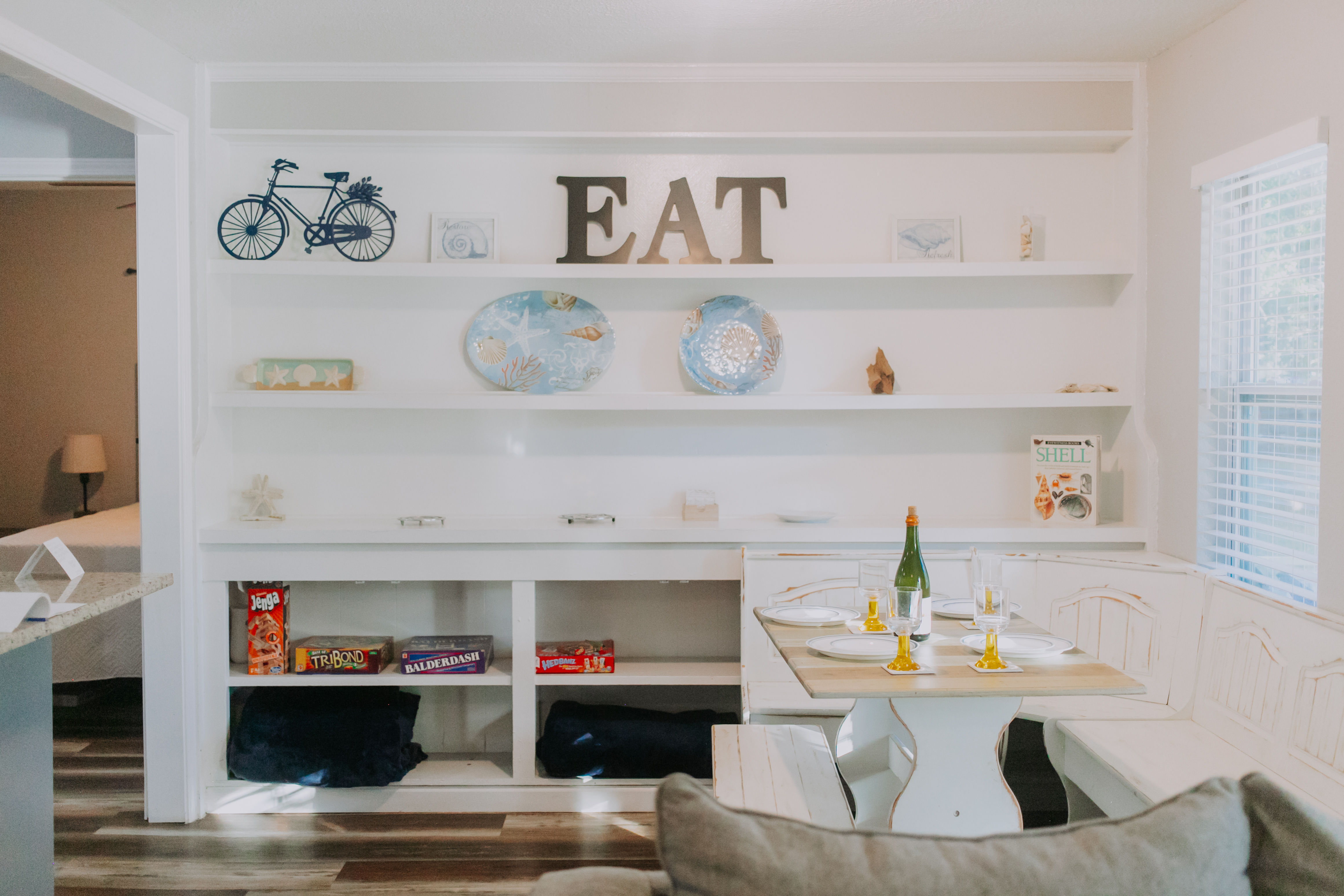 image Enjoy the inviting atmosphere of the dining area, highlighted by playful decor and a selection of board games for family fun.