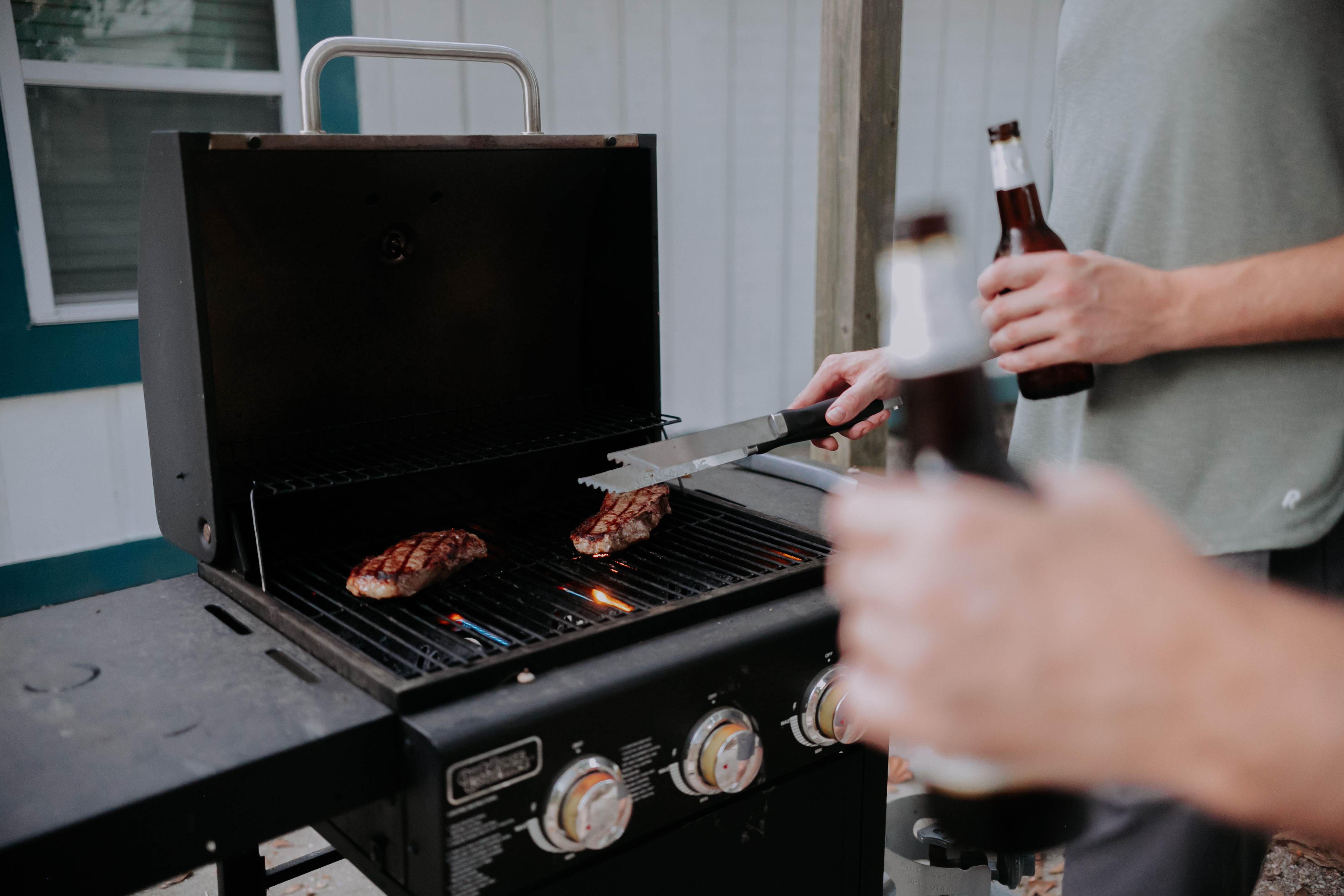 image Fire up the grill for a backyard BBQ with friends at this coastal retreat.