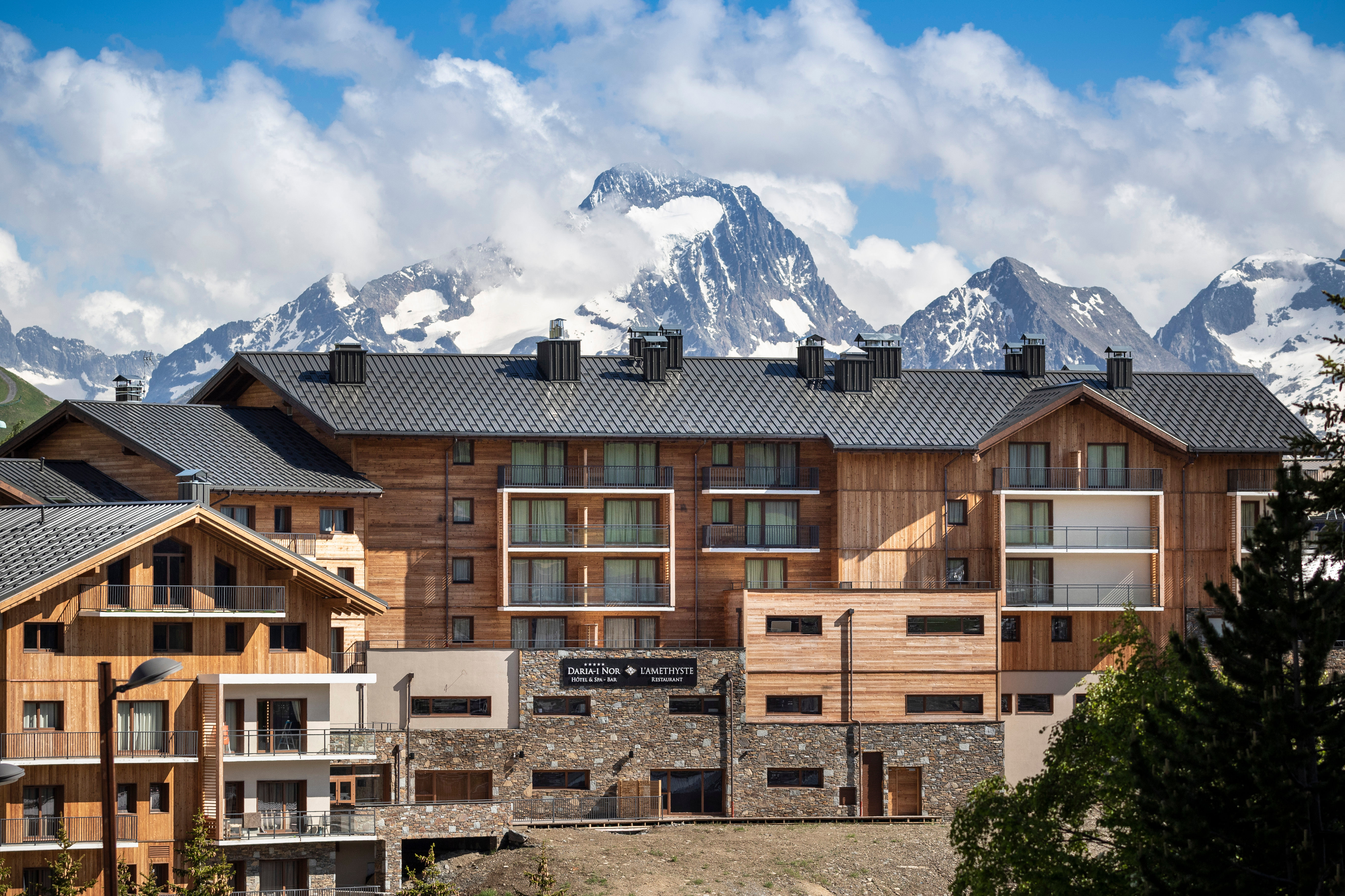 image Elegant alpine architecture set against the dramatic peaks of Tignes.