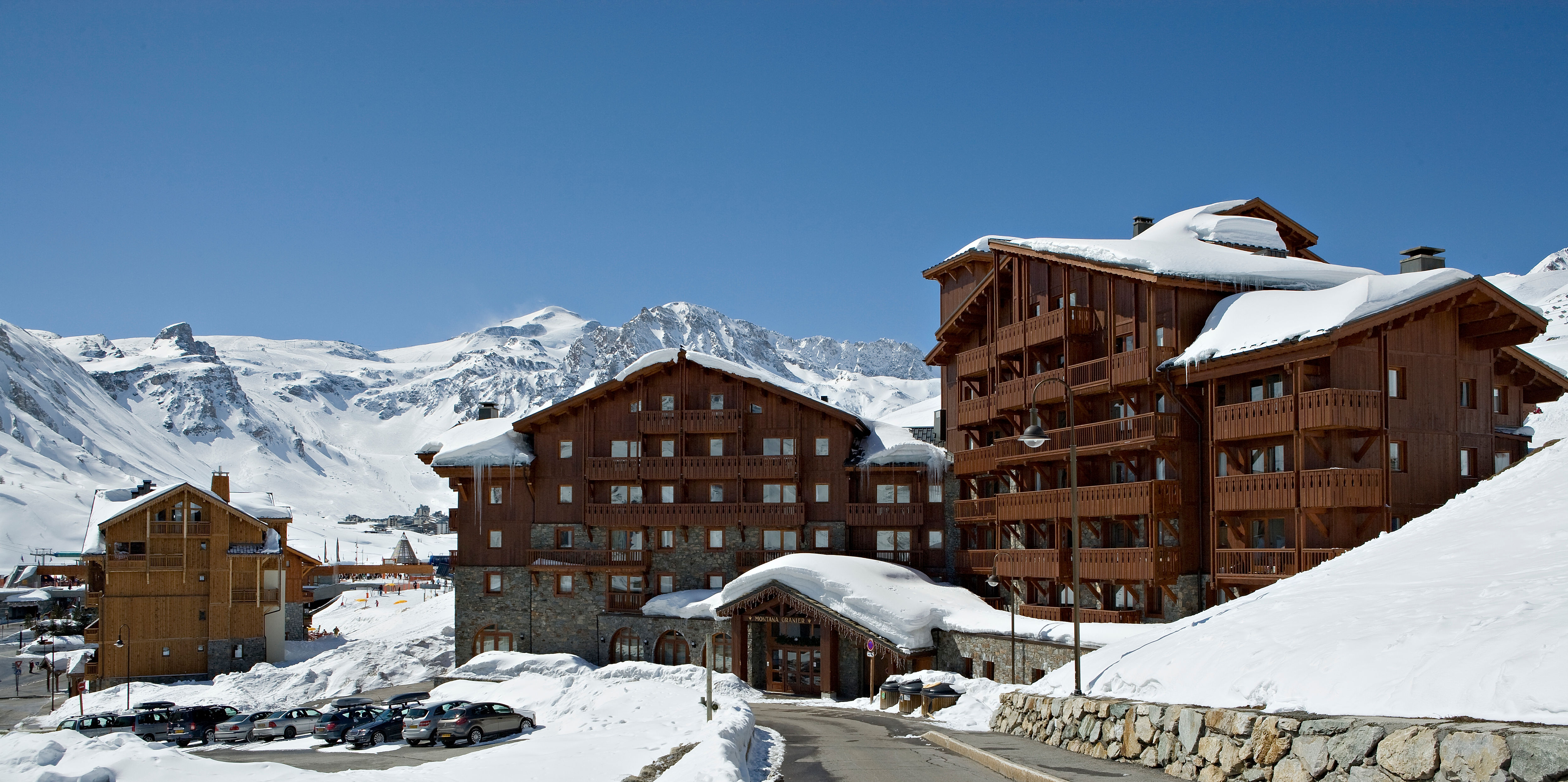 image Spacious chalet-style buildings nestled among the peaks offer comfort with unbeatable access.