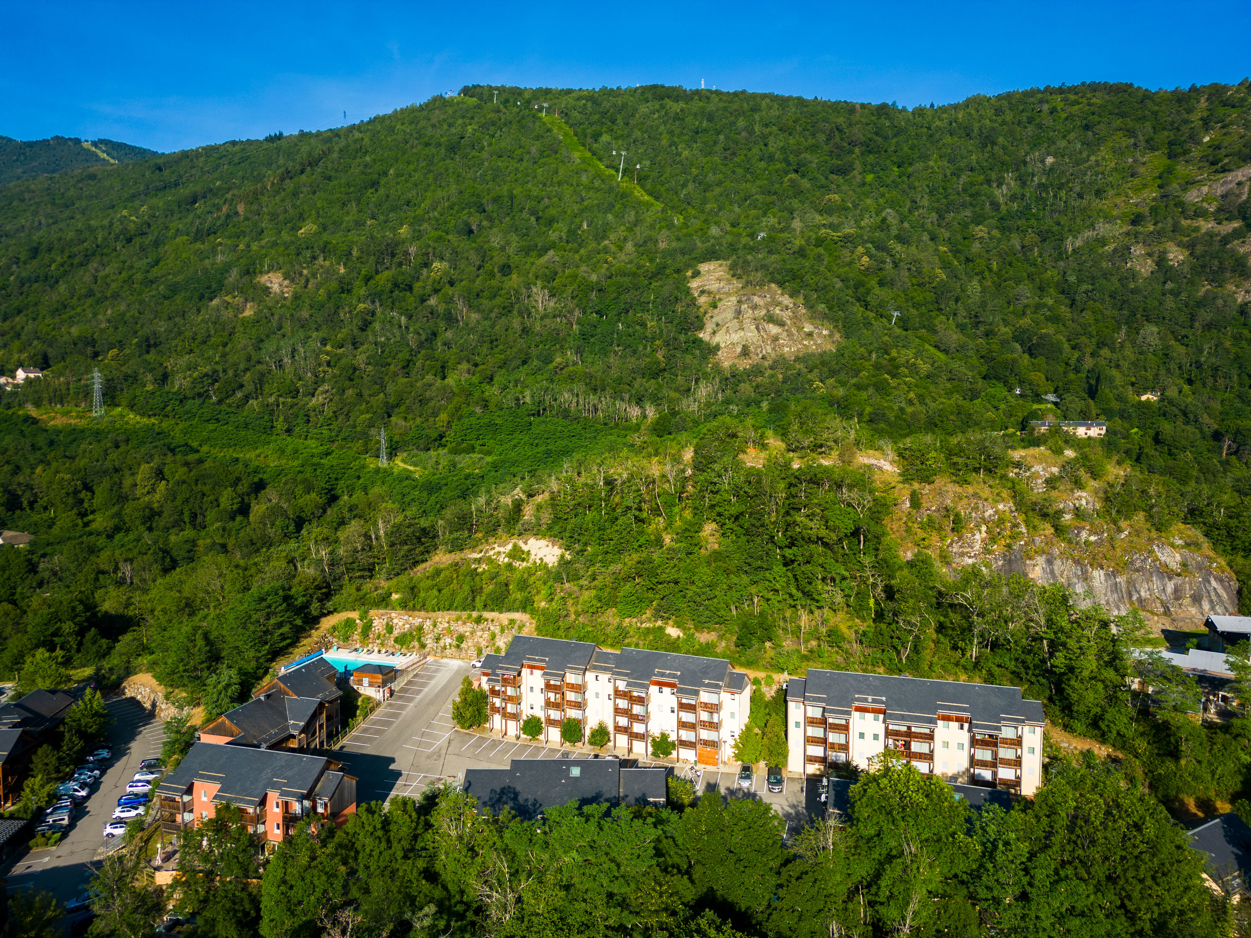 image Surrounded by lush forest, this peaceful alpine escape promises pure tranquility.