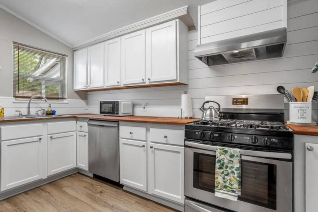 image The modern kitchen is equipped with everything you need to whip up delicious meals, setting the stage for memorable dining experiences.