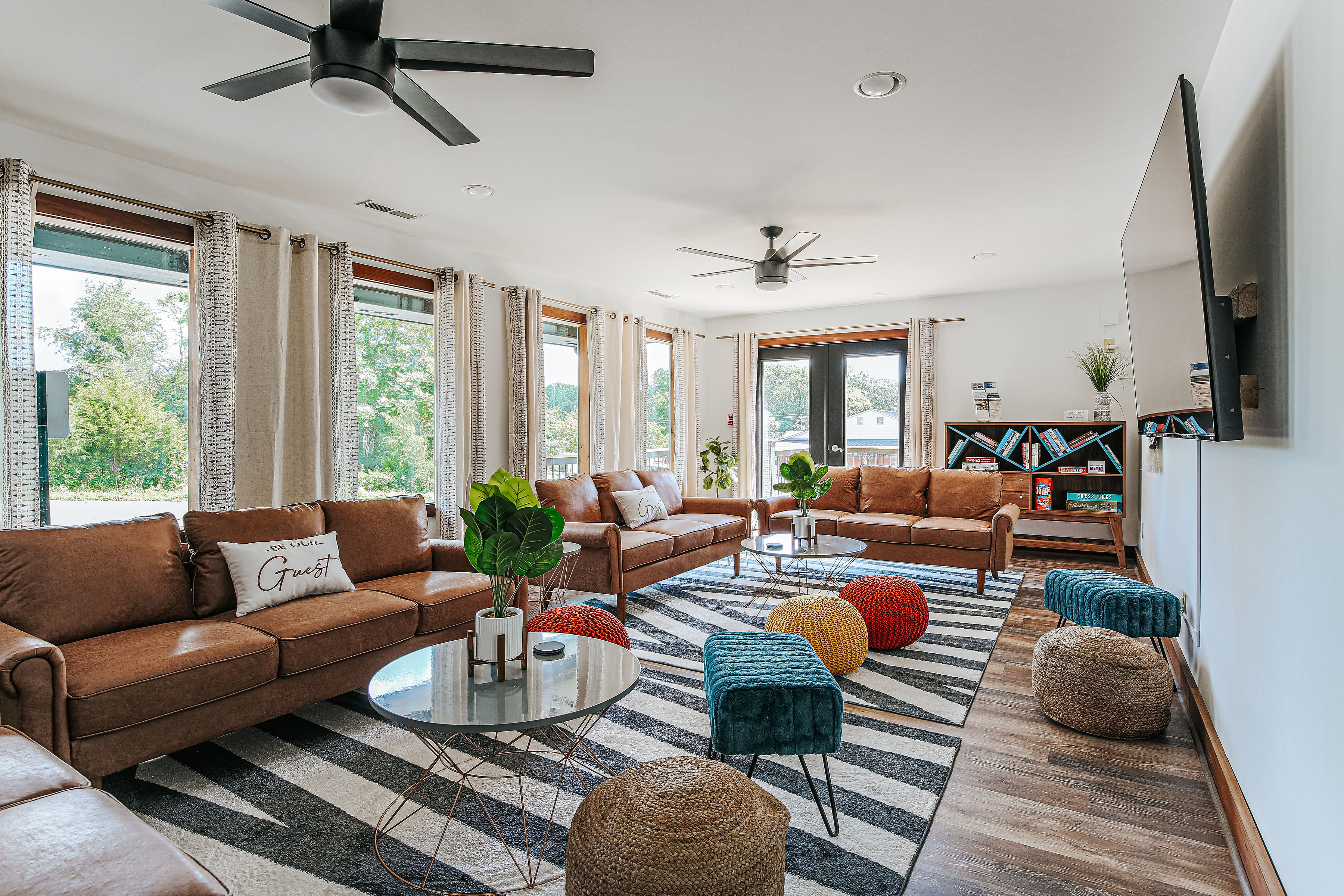 image The vibrant décor and large windows enhance the inviting atmosphere of the common space.