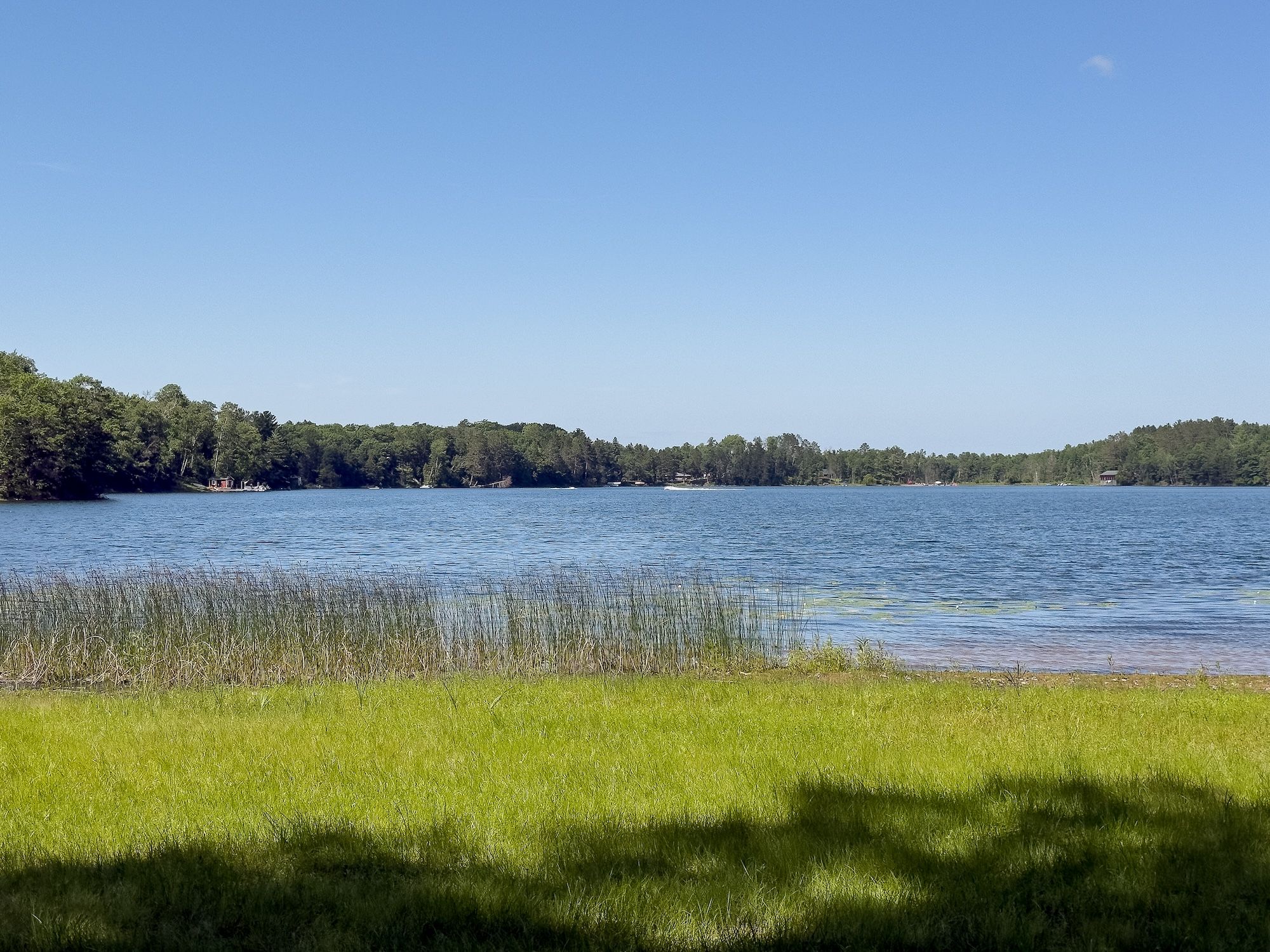 image Sparkling lakeshore just steps from your door, offering breathtaking views and endless opportunities for playing and quiet reflection.