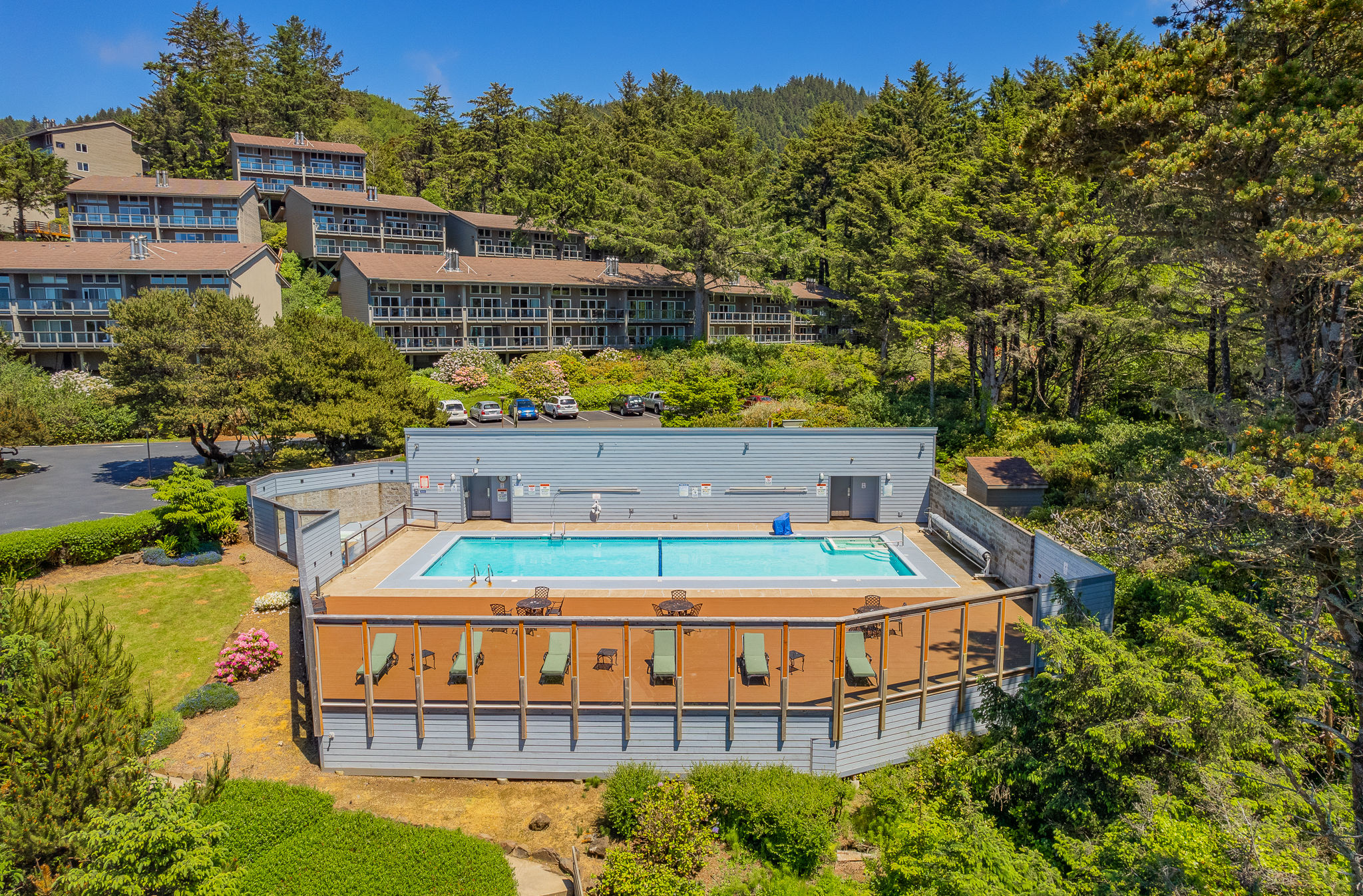 image Nestled amidst towering trees, the heated pool area complements the resort's inviting atmosphere, perfect for a memorable getaway.