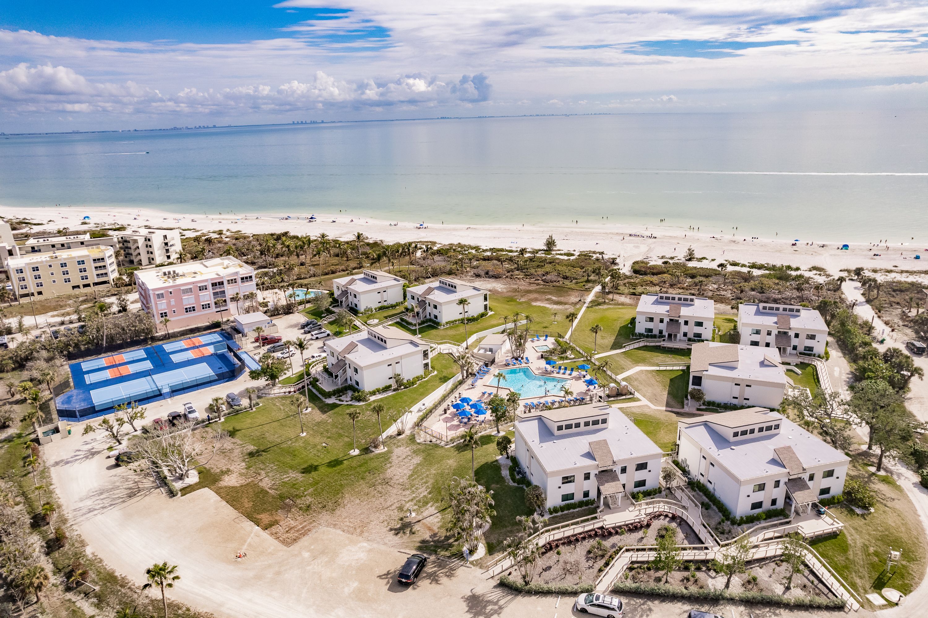 image Aerial view of Sanibel Beach Club’s Gulf-front location with sparkling waters just steps away.
