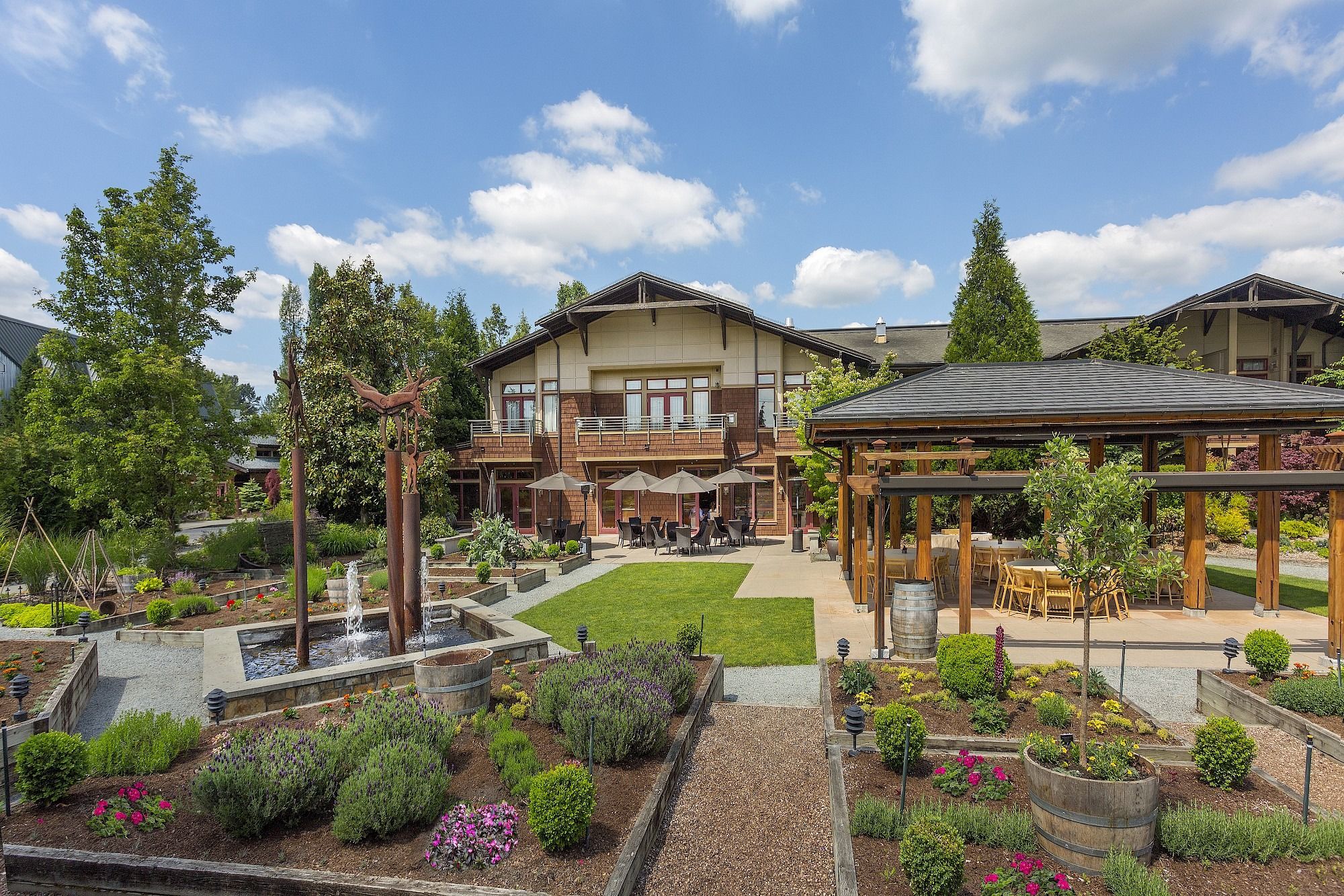 image Surrounded by blooming gardens and tranquil pathways, the lodge welcomes you into a serene escape.