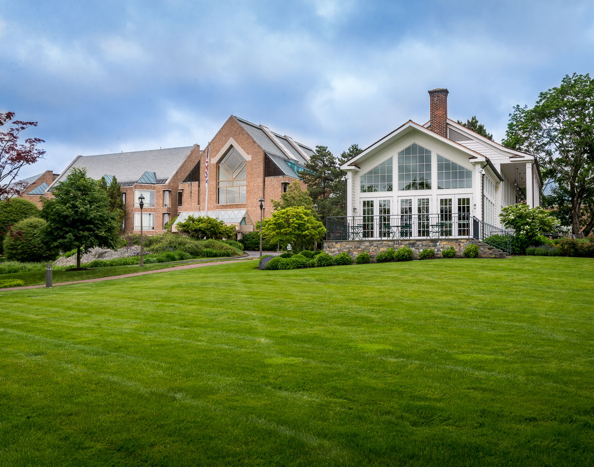 image The stunning facade of Croton Hall and Cafe 56 showcases elegant architecture surrounded by meticulously manicured gardens, inviting guests to experience luxurious comfort and tranquility.