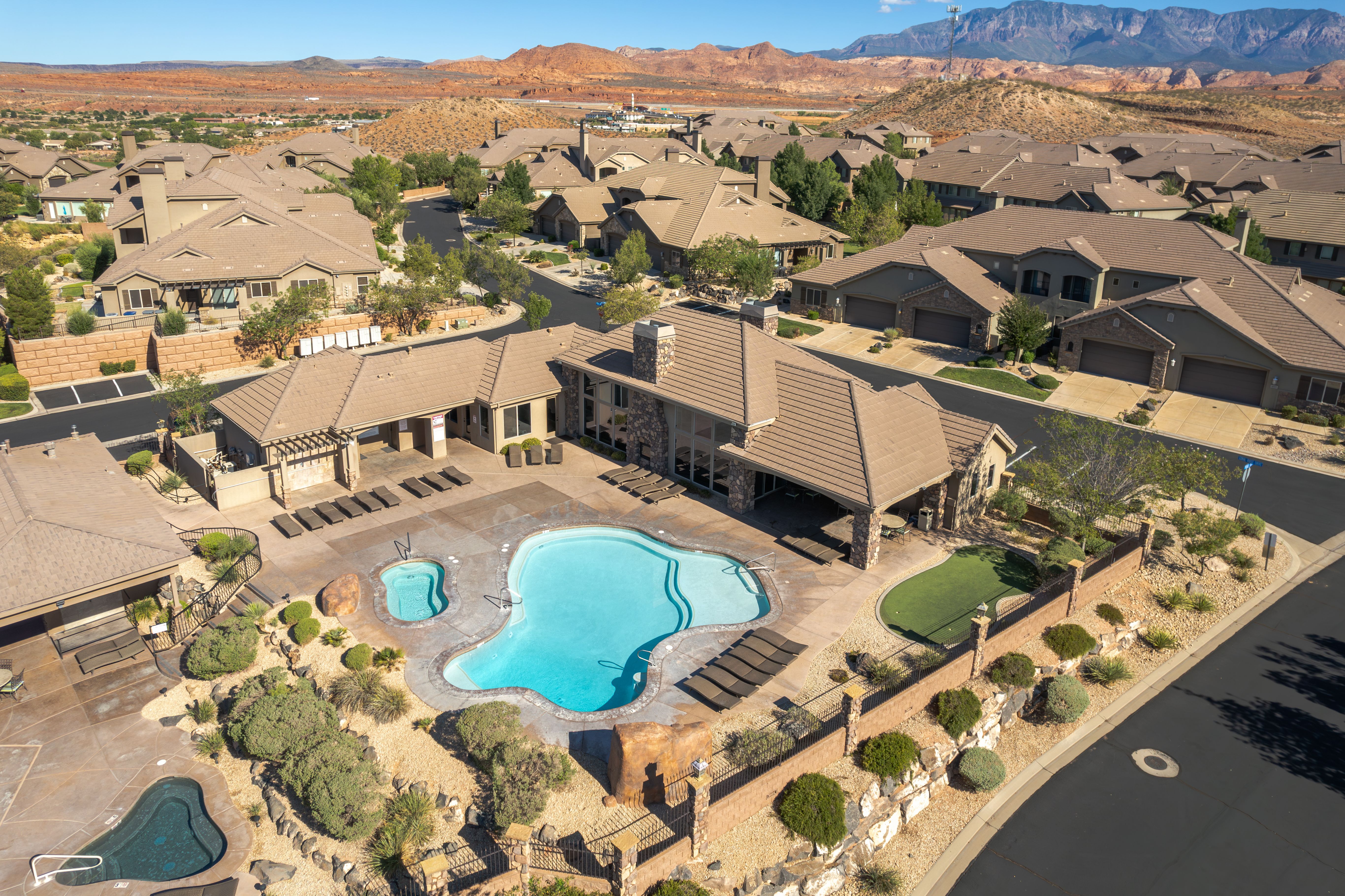 image Aerial view of Canyon Villas pool area with desert backdrops and scenic red rock views.