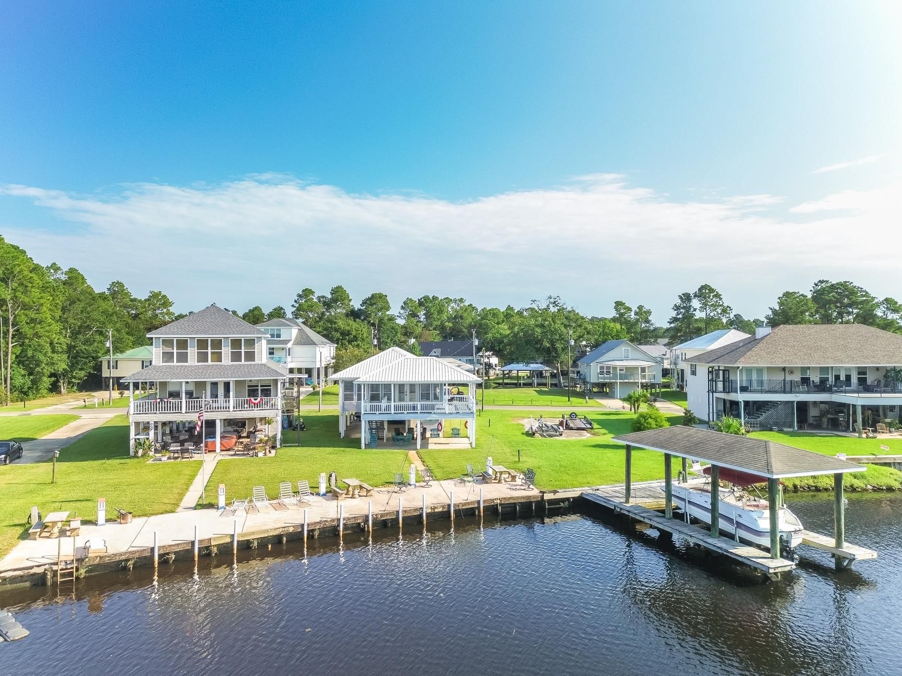 image This charming area features multiple outdoor lounges, ideal for gathering with family and friends by the water.