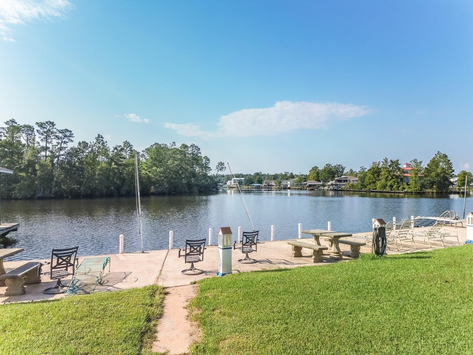 image Enjoy serene river views from the private dock, perfect for fishing or relaxing under the sun.
