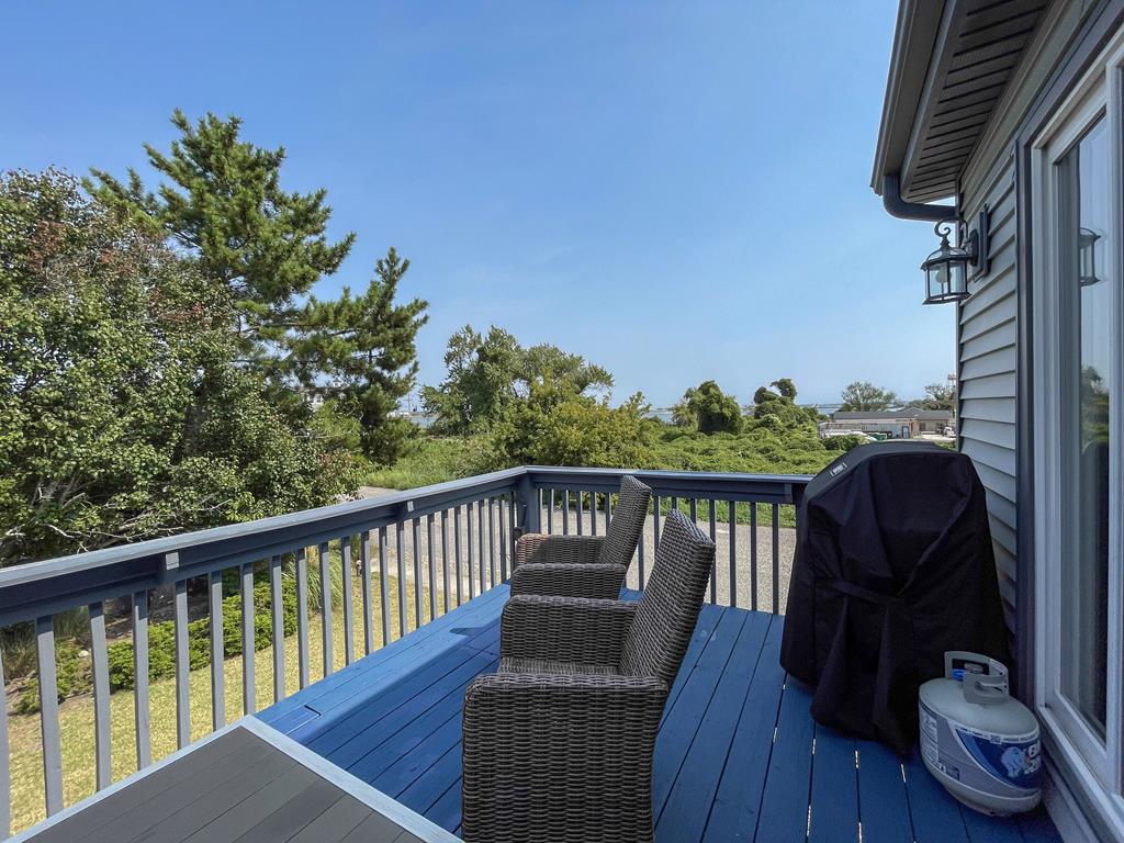 image Private balcony with outdoor chairs and relaxing views.