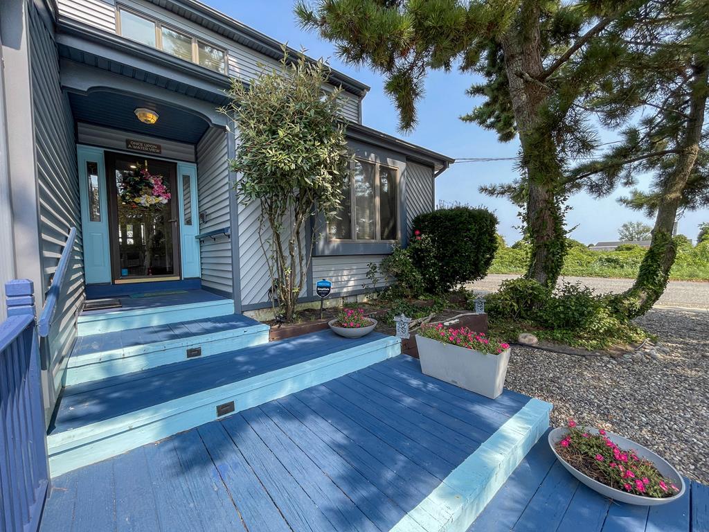 image Bright blue entry walkway welcomes you to your Cape May coastal retreat.