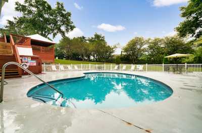 Dive into relaxation with this sparkling pool, surrounded by trees and sky-high serenity.