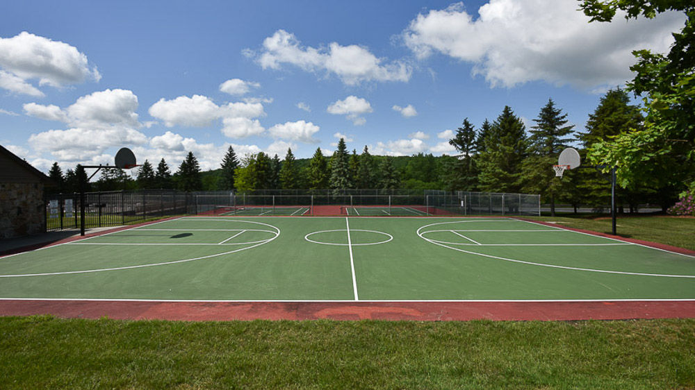 image Expansive courts for friendly games under wide-open skies, where crisp mountain air adds energy to every serve and shot.