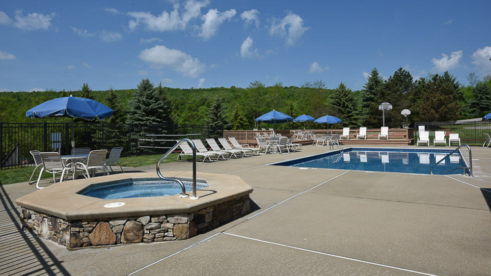 image Serene pool area offering the ultimate spot to relax, unwind, and take in the beauty of the Laurel Highlands.