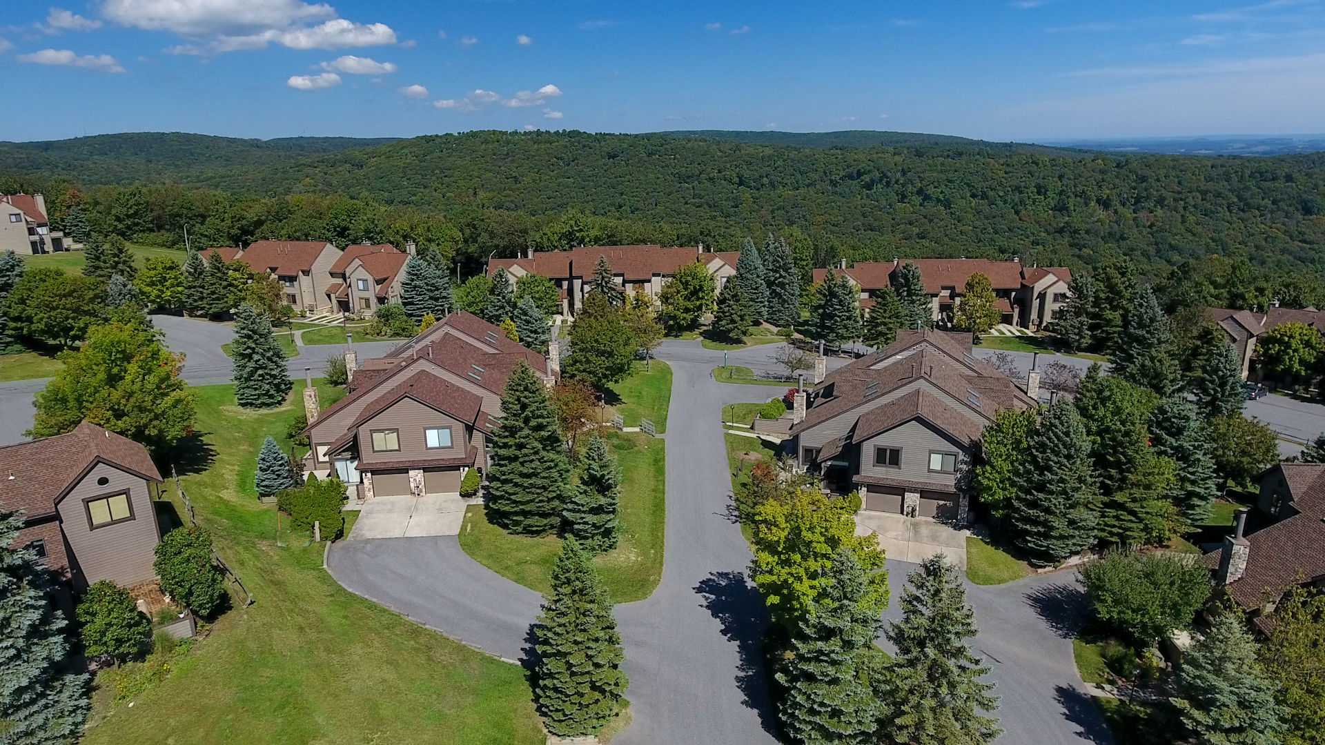 image Aerial view revealing lush greenery and quiet lanes that make this mountain retreat feel like a true home away from home.