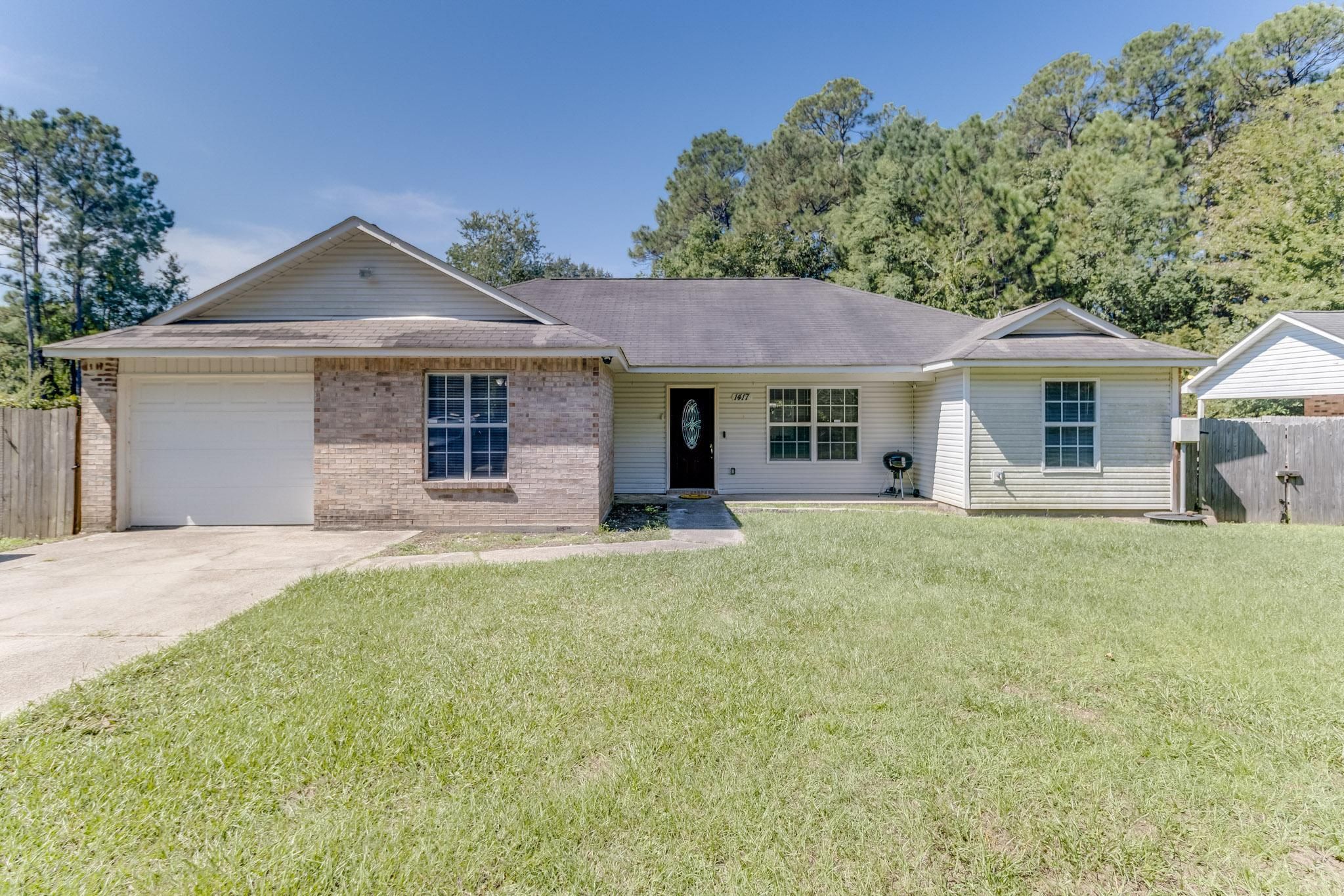 image Delight in the welcoming curb appeal and ample driveway parking.