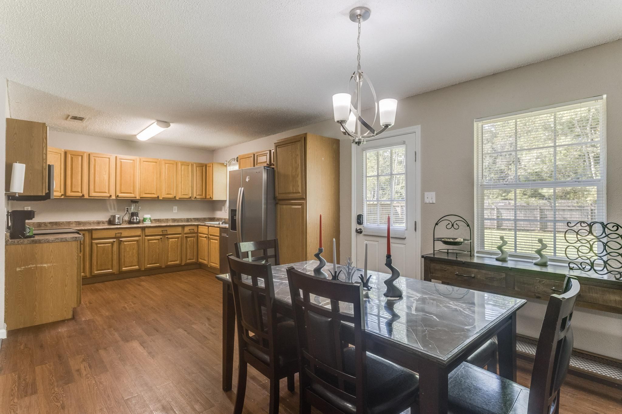 image Share meals at the dining table with seating for six, steps from the kitchen.