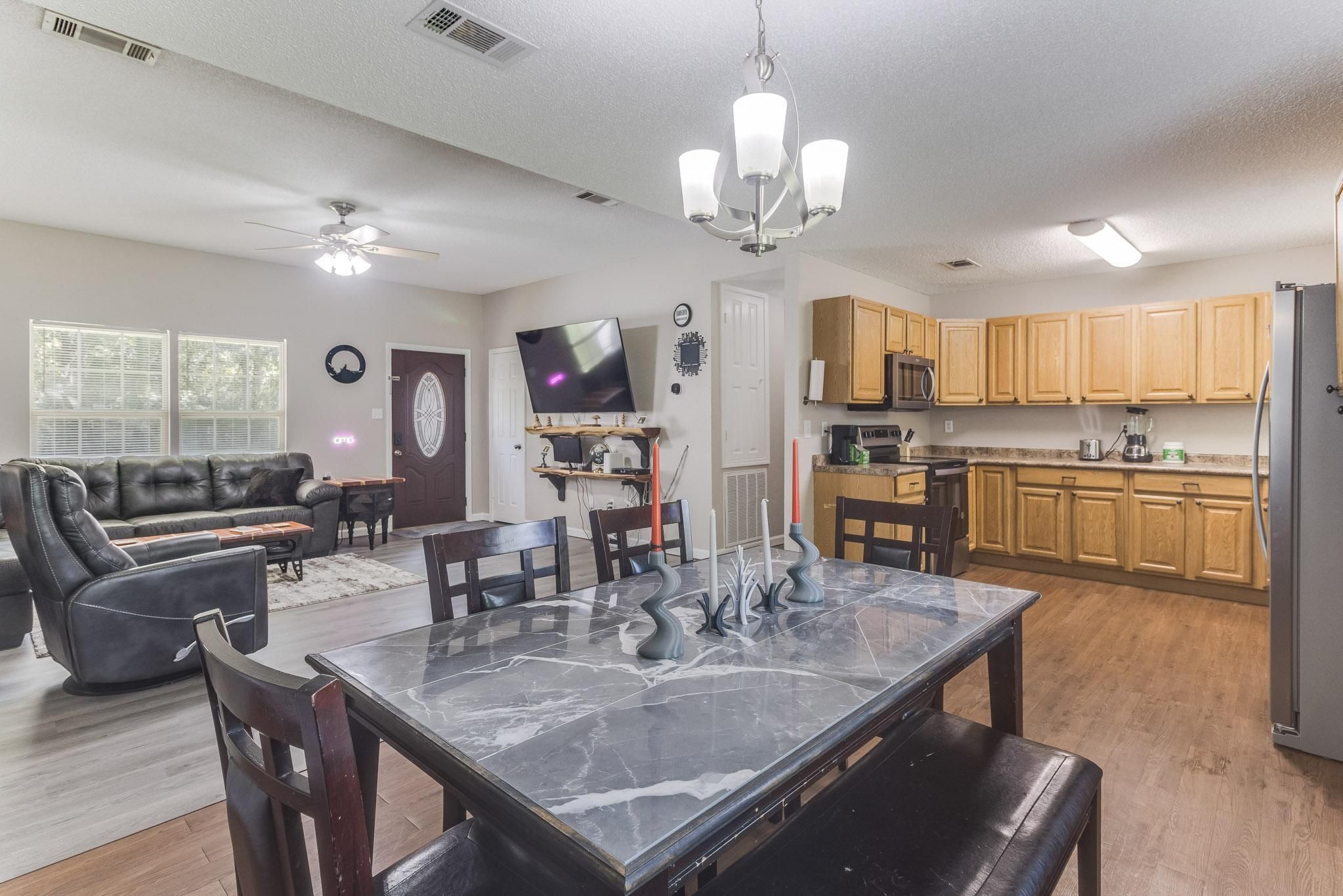 image Cook with confidence in the full kitchen boasting stainless steel appliances and ample counter space.