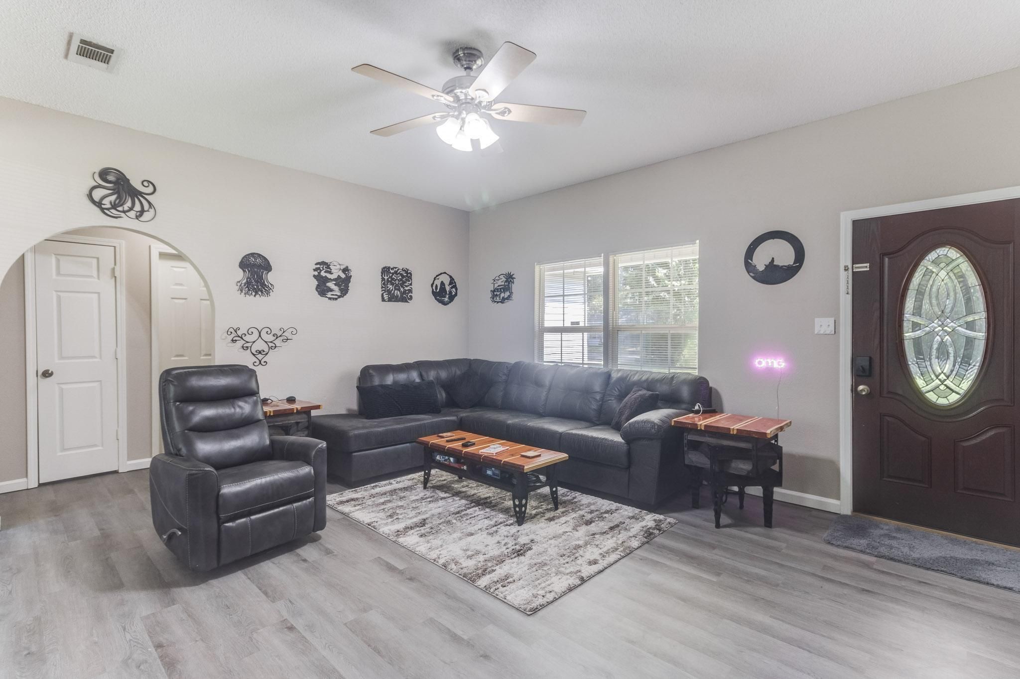 image Relax in the cozy lounge area featuring recliners and inviting décor.