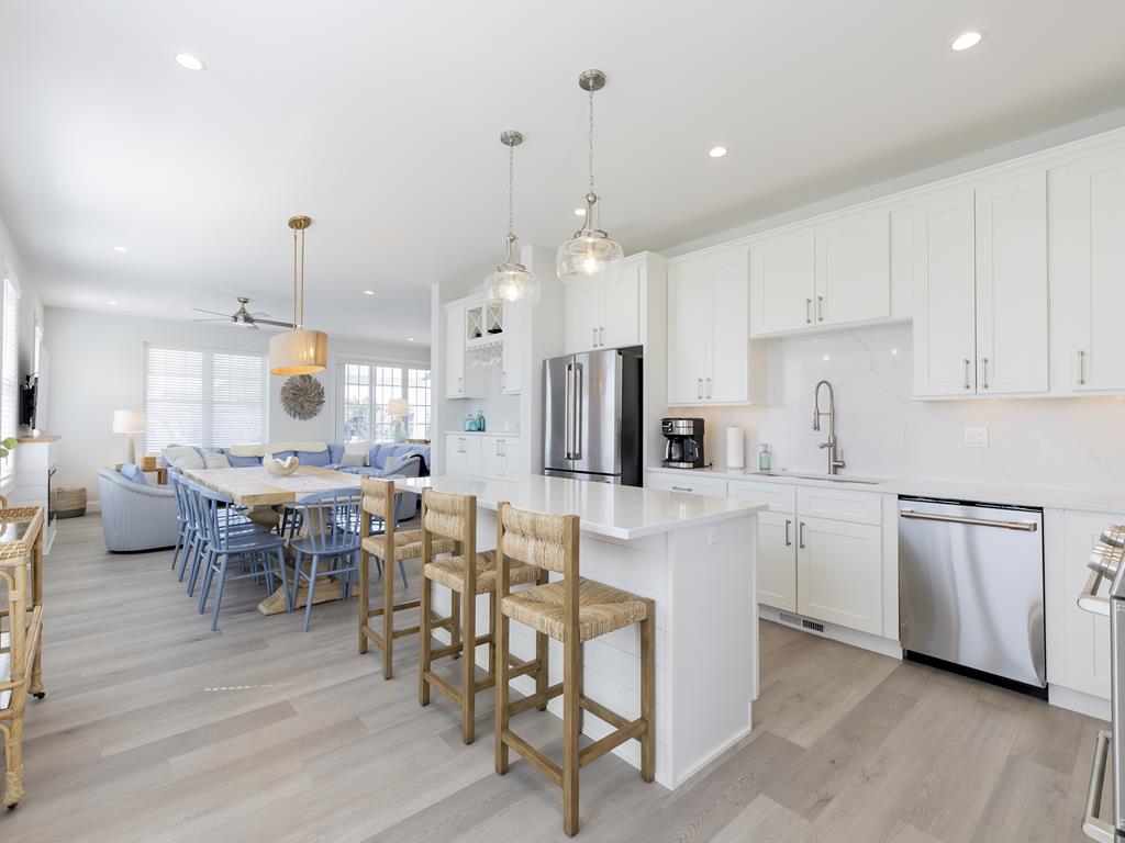 image Open-concept kitchen and dining space with double refrigerators and seating for the whole crew—perfect for group meals.
