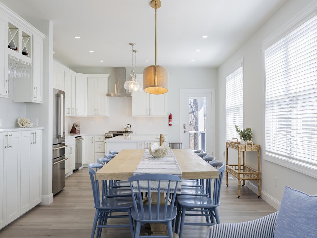 image Elegant dining area with seating for 10 and natural light pouring through the windows—perfect for shared meals and celebrations.