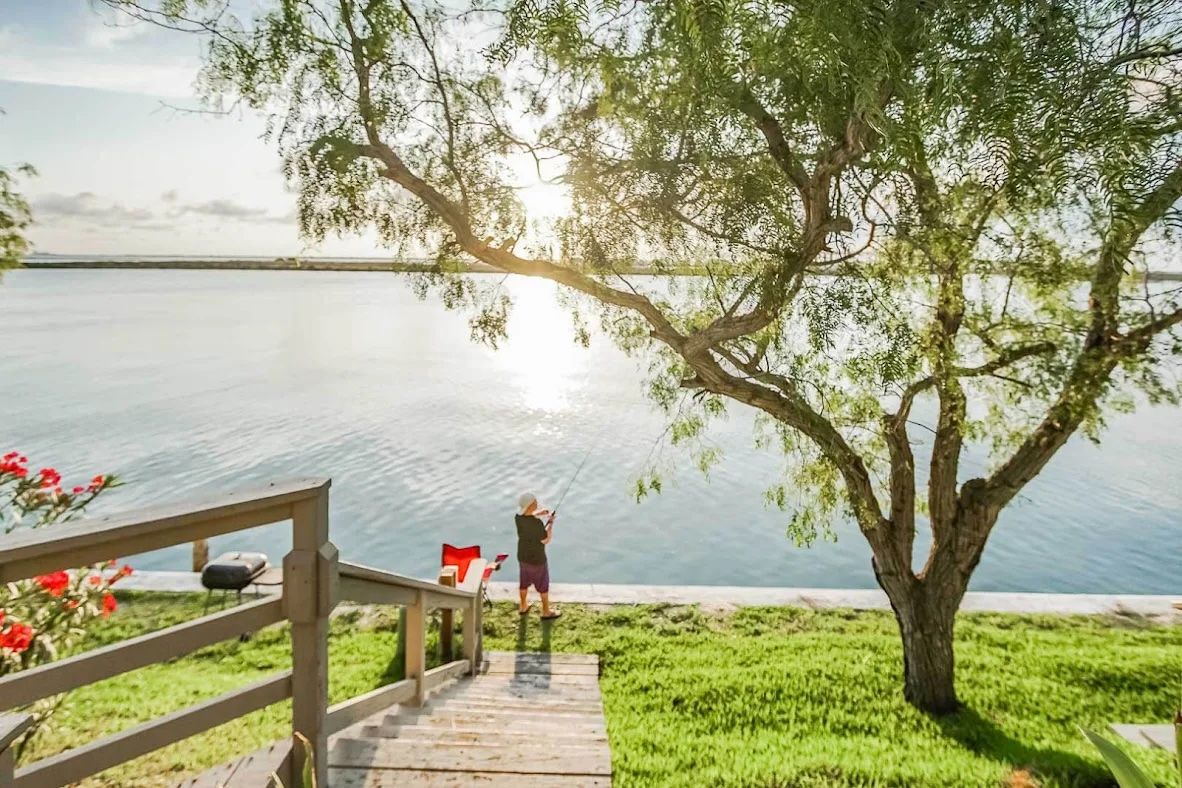 image Dockside serenity with fishing access and breathtaking bayfront sunsets.