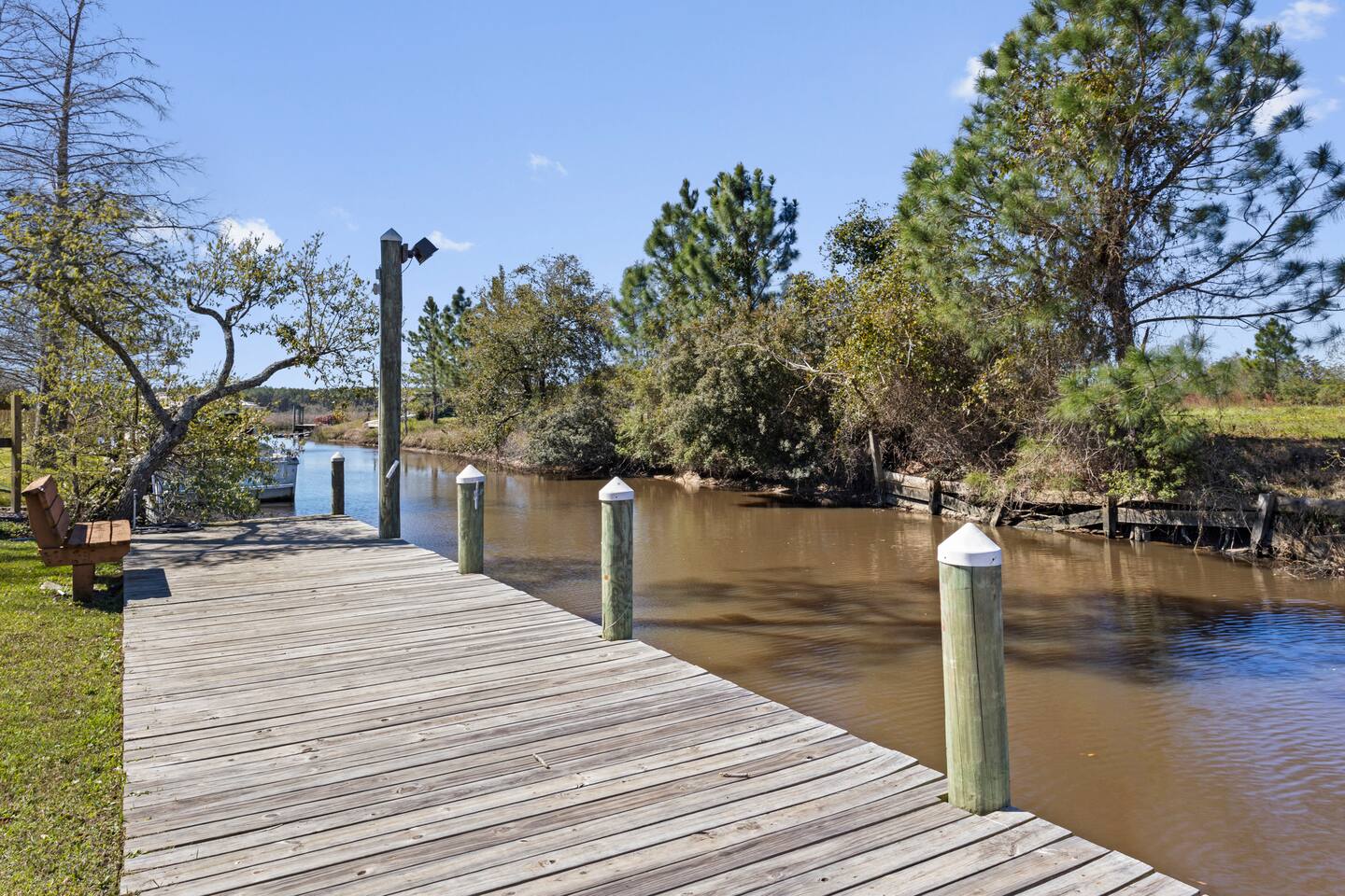 image The private dock extends into tranquil waters, providing an ideal spot for boat access or peaceful afternoons.