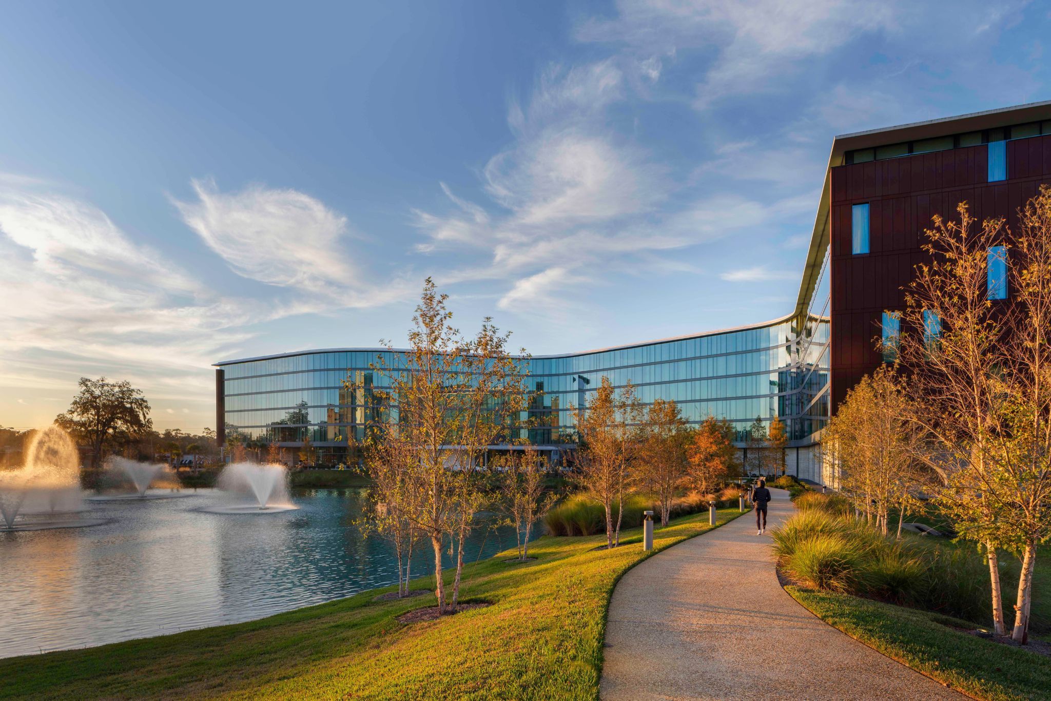 image The stunning facade of Hotel ELEO reflects the tranquil lakeside, showcasing a perfect blend of modern architecture and serene surroundings.