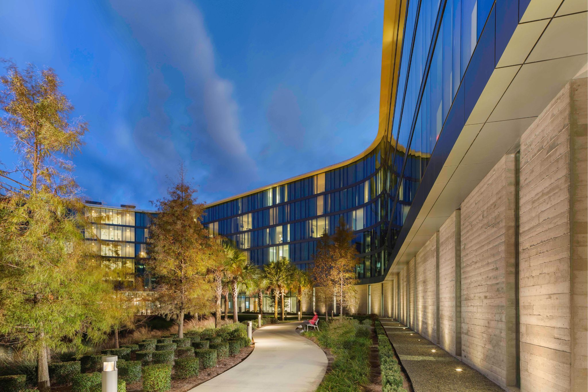 image The beautifully landscaped pathways at Hotel ELEO invite relaxation, leading guests through tranquil outdoor spaces enriched with greenery.