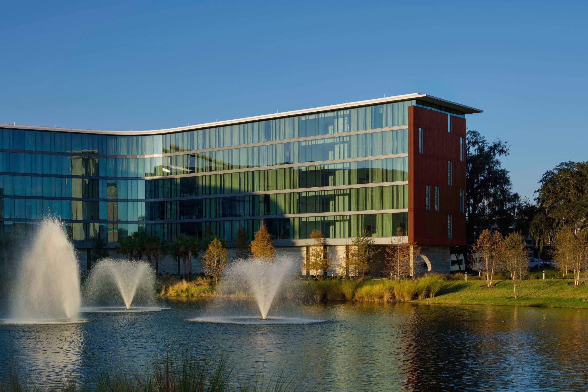 image With its elegant glass façade and lakeside fountains, Hotel ELEO offers a luxurious retreat, inviting guests to unwind in style.