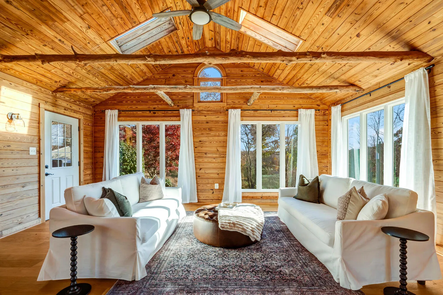 image The Wood Room features warm wood accents and panoramic forest views, a tranquil spot to unwind.