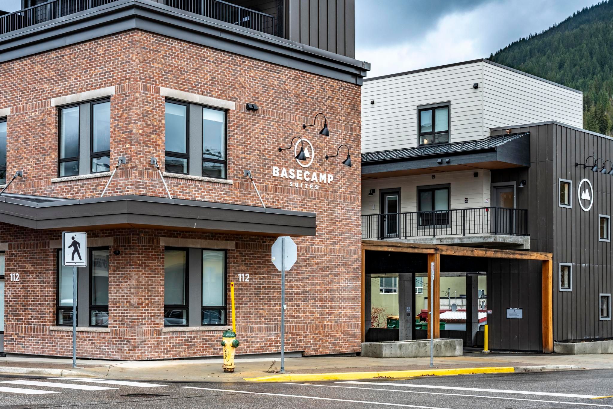 image The charming facade showcases a blend of modern design and rustic mountain-town aesthetics, perfectly nestled among the surrounding beauty of Revelstoke.