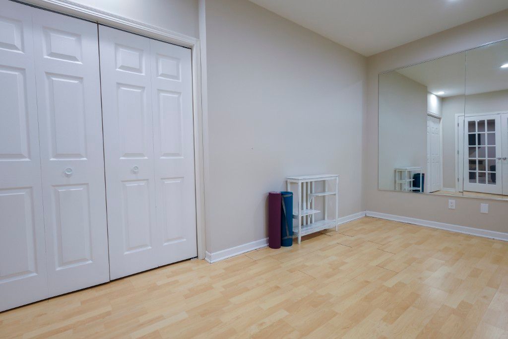 image With a versatile space that invites relaxation and workout, this bright room is perfect as a cozy yoga studio, embodying the spirit of comfortable, private home life.