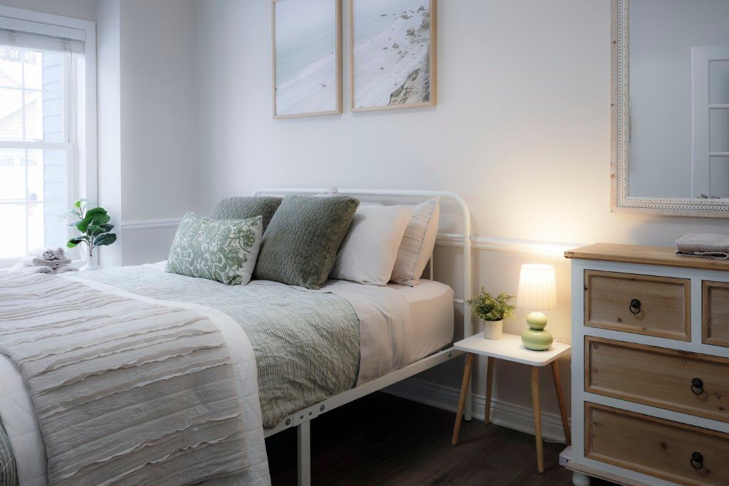 image This serene bedroom combines soft decor and soothing colors, offering a blissful retreat for families seeking a peaceful night's sleep in the heart of Lake Geneva.