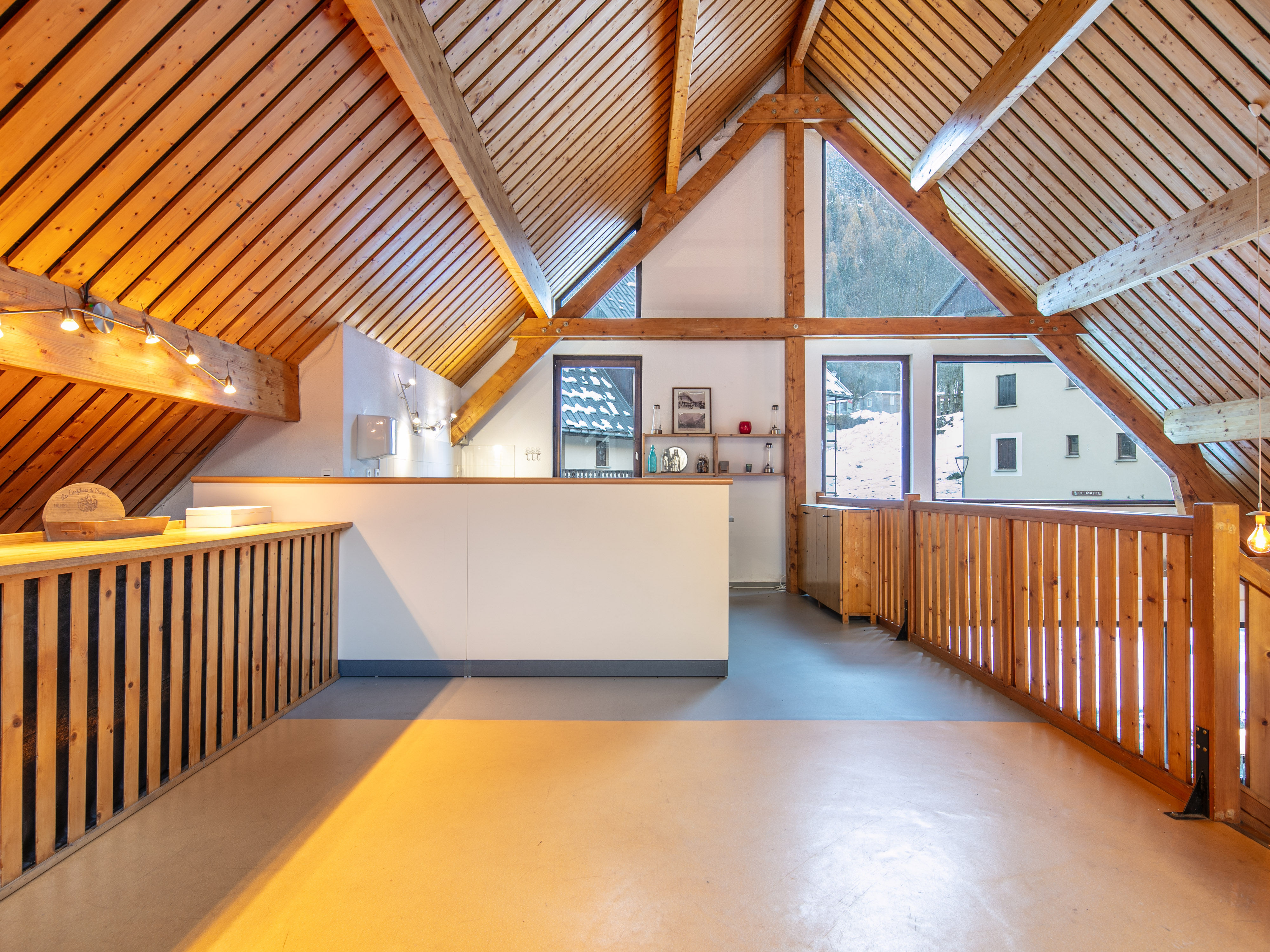 image The charming reception area showcases traditional Savoyard architecture, inviting guests to unwind while overlooking the picturesque mountains of Saint-Colomban-des-Villards.
