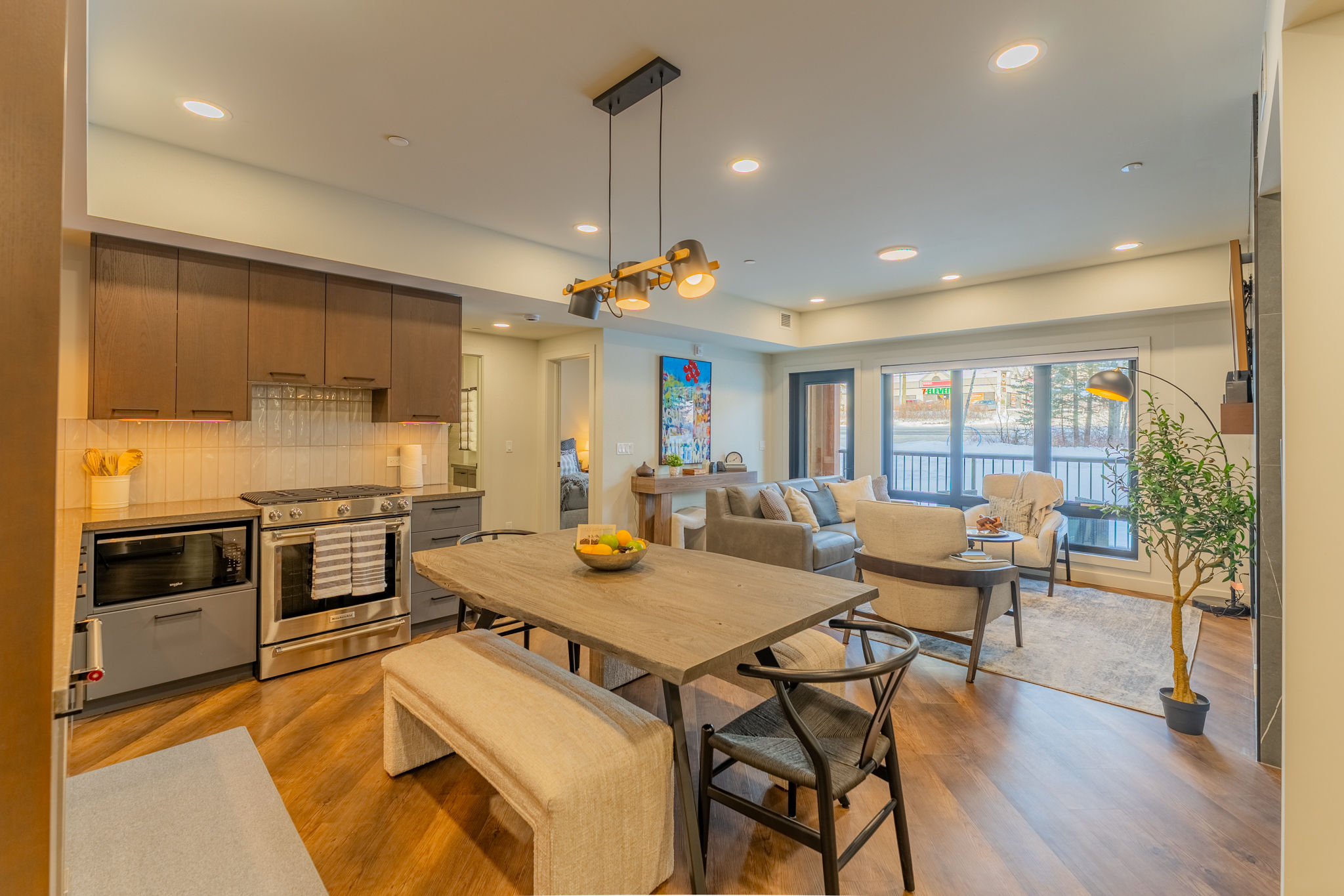 image Enjoy bright living spaces with large windows and chic furniture.