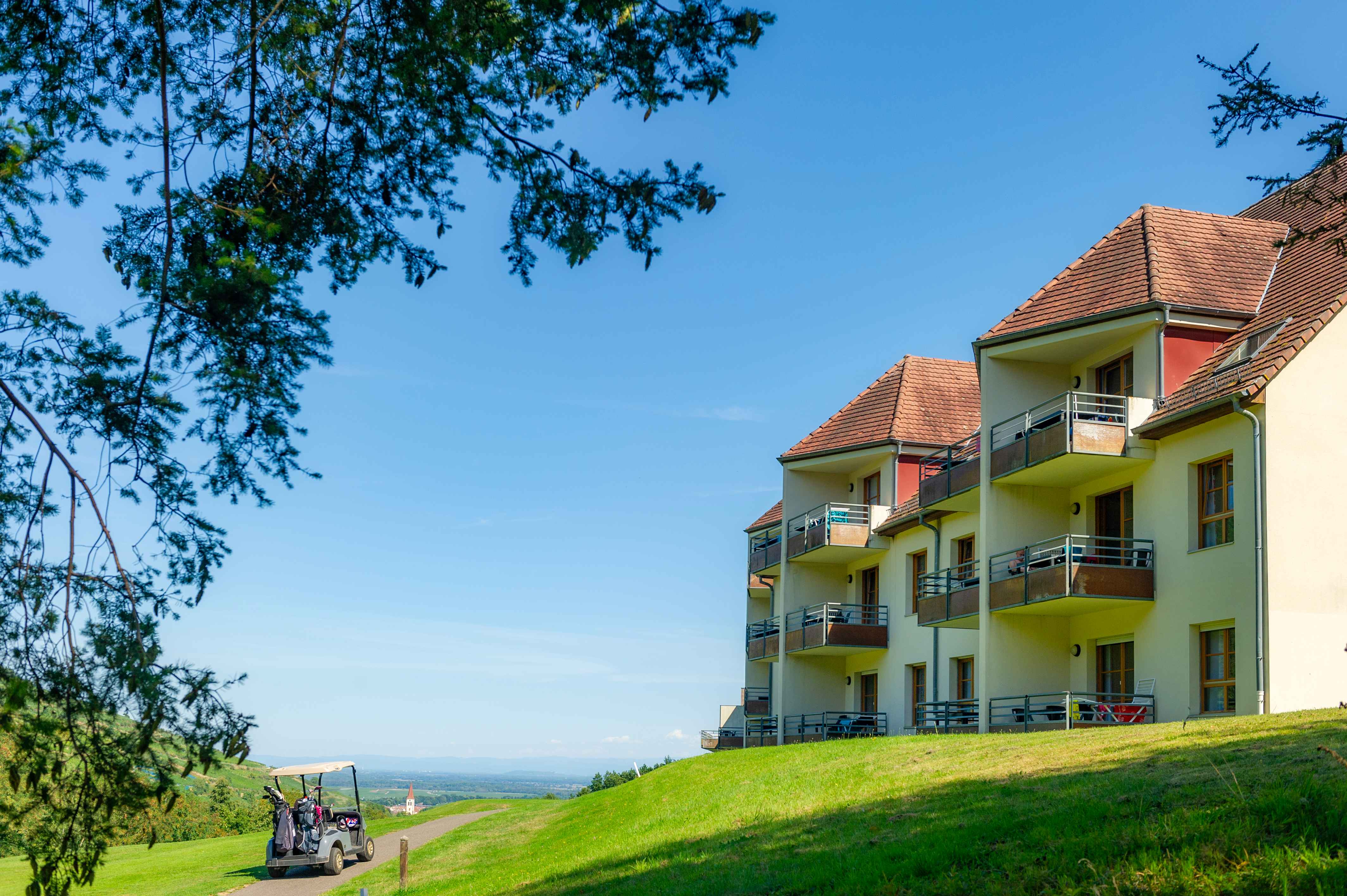 image The residence's terraced architecture blends into the hillside, with sweeping views of the greens and the surrounding countryside.