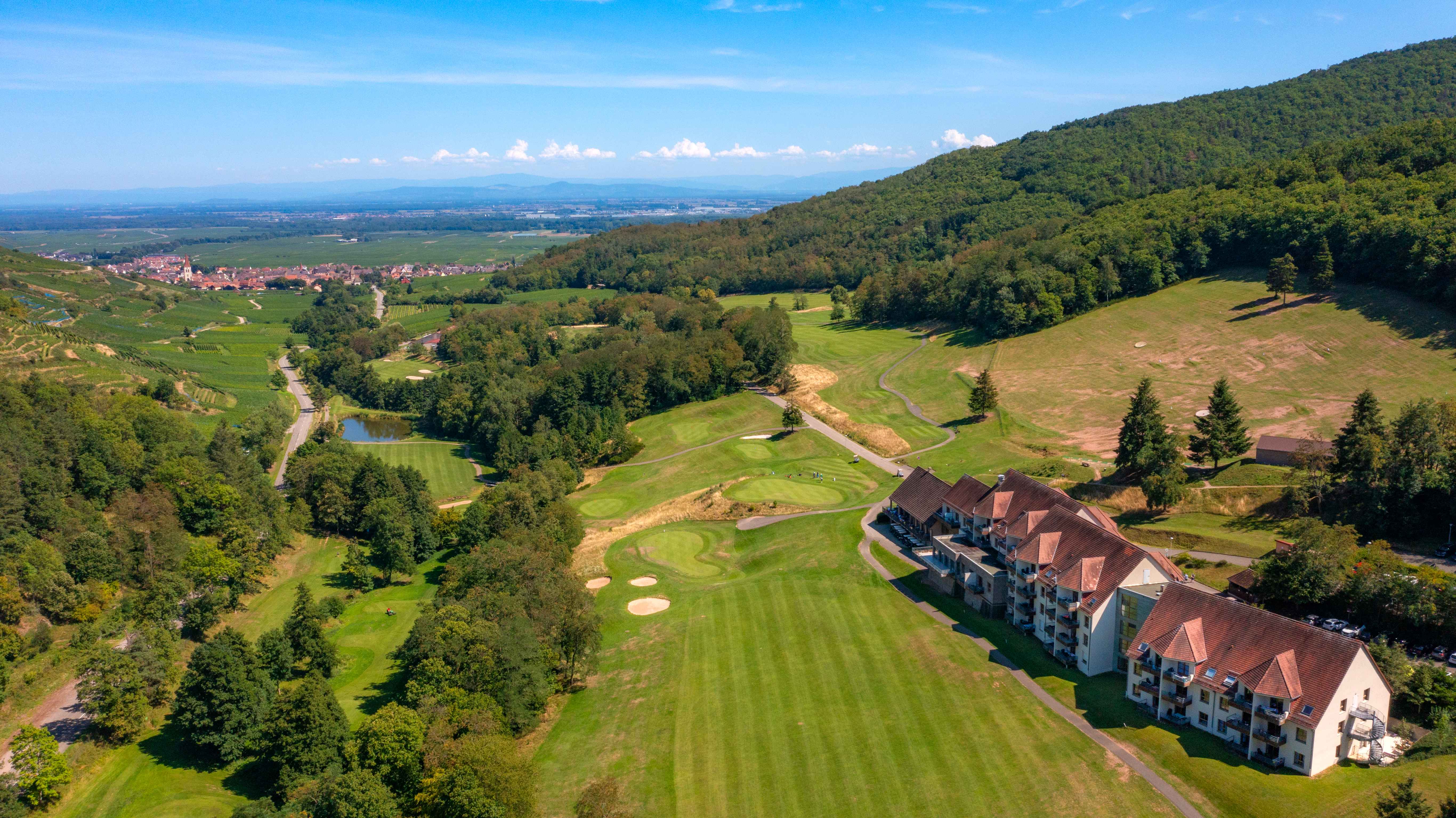 image The residence sits at the edge of the course, with the Alsatian hills and vineyards forming a natural backdrop.