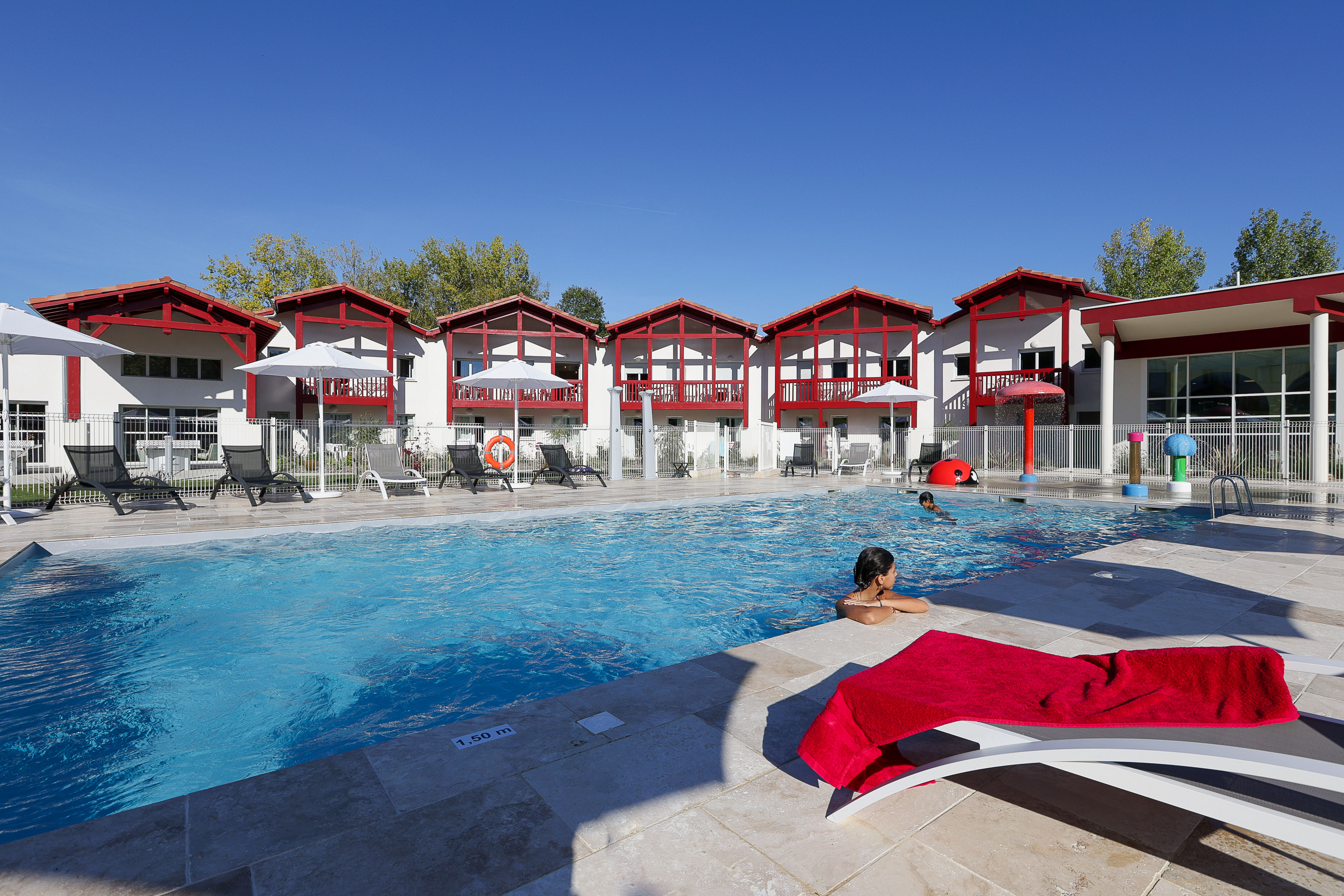 image Splash into summer at the outdoor heated pool, where lazy afternoons and water slides make every day feel like a holiday in the Basque Country.