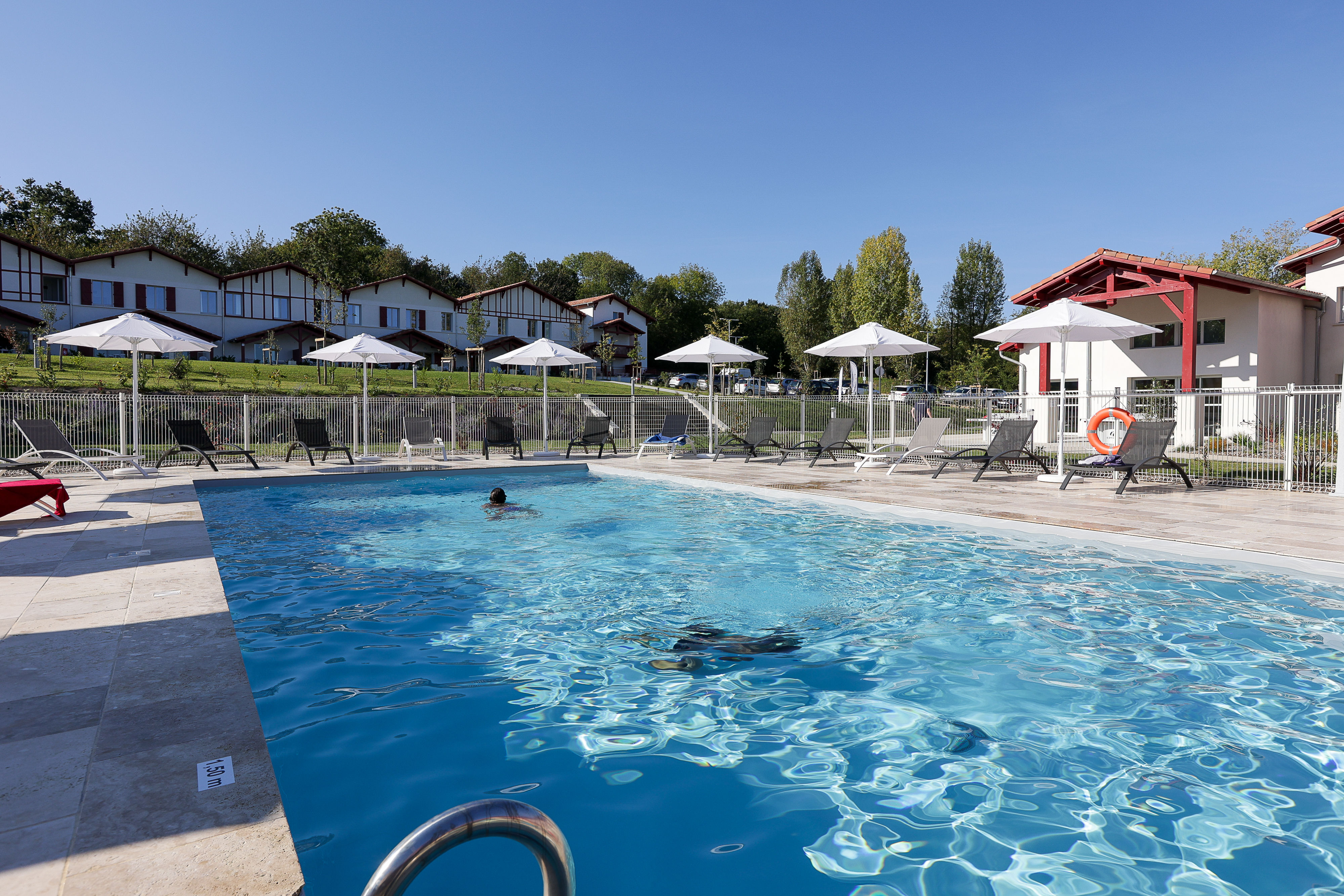 image Unwind by the resort's spacious outdoor heated pool, open from April through September — the perfect spot to recharge between coastal adventures near Saint-Jean-de-Luz.