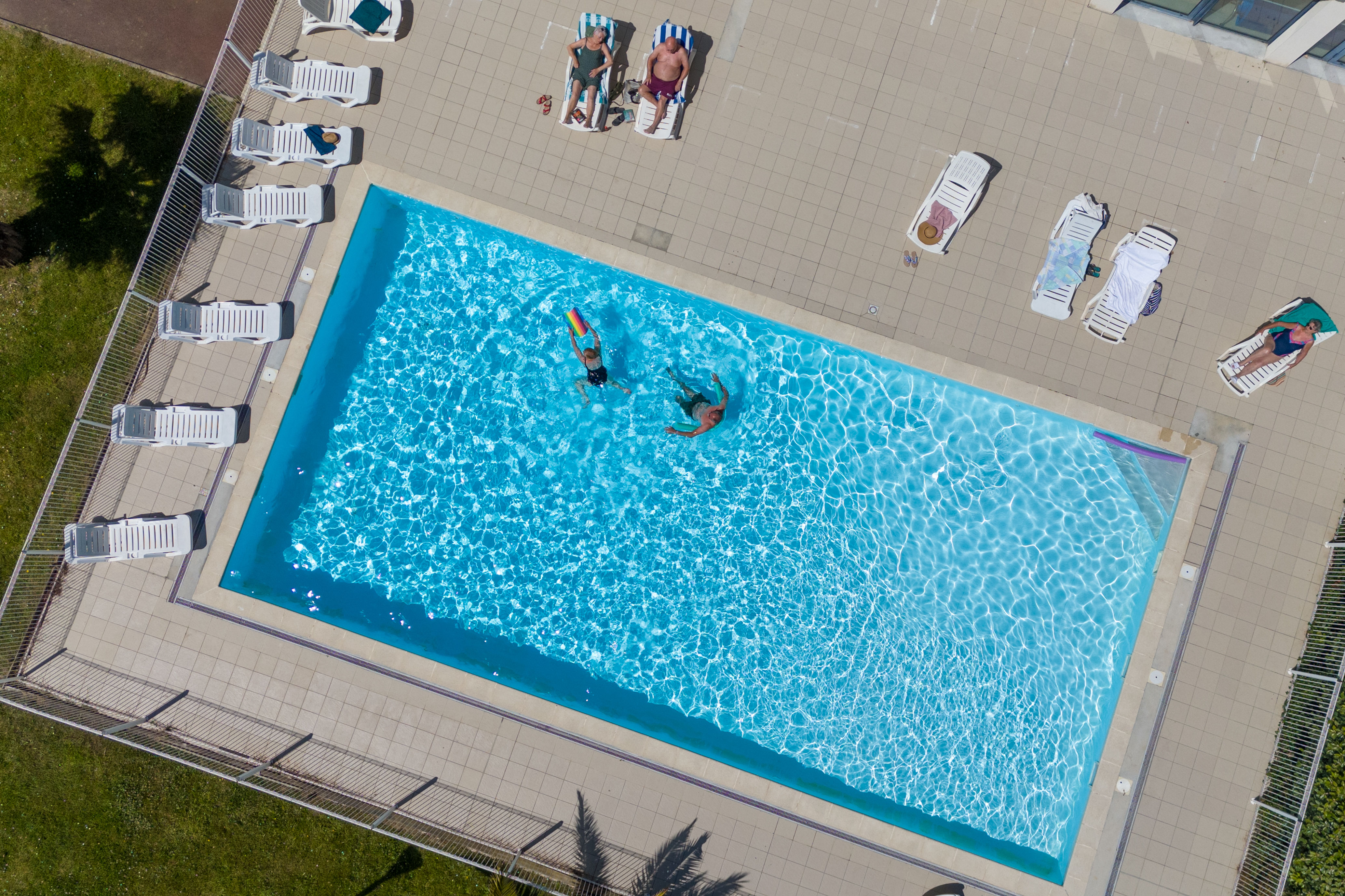 image A bird's-eye view of the outdoor pool, surrounded by the residence's tranquil pedestrianised grounds.