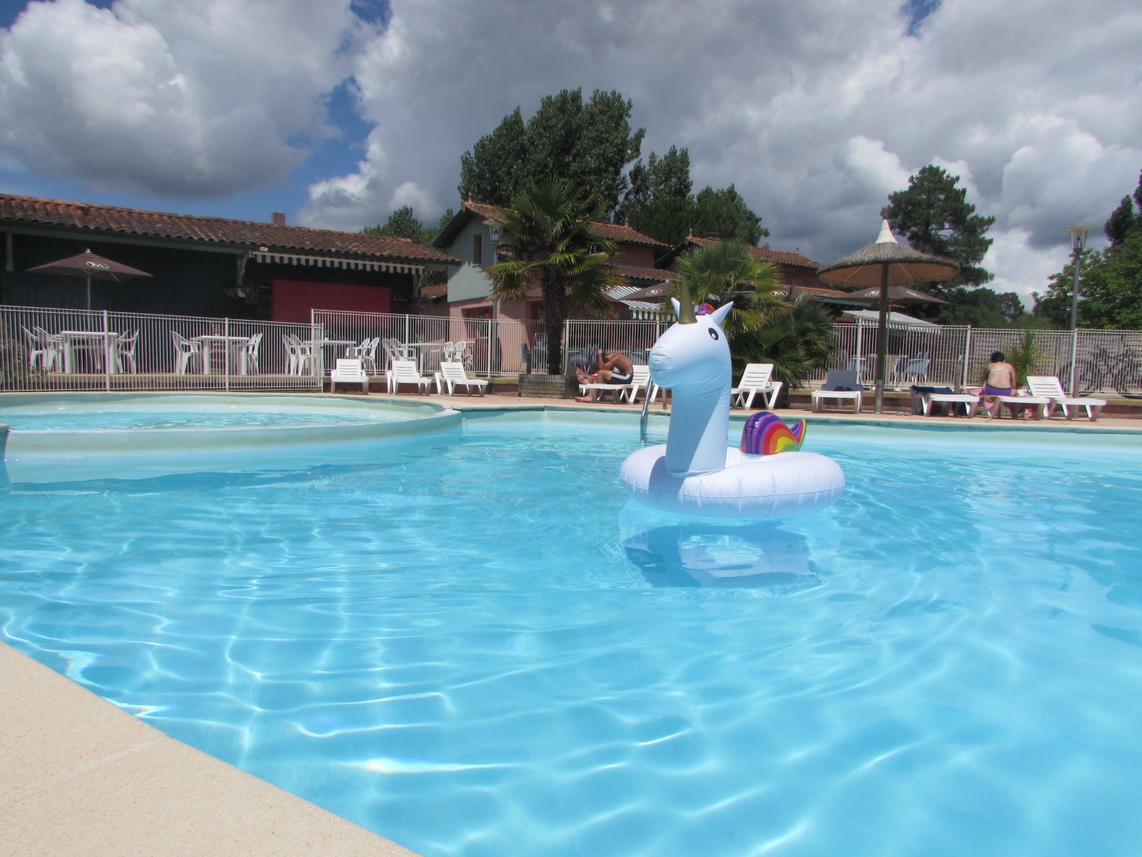 image Colourful floats and a children's pool area make the outdoor aquatic space a favourite for families all summer long.