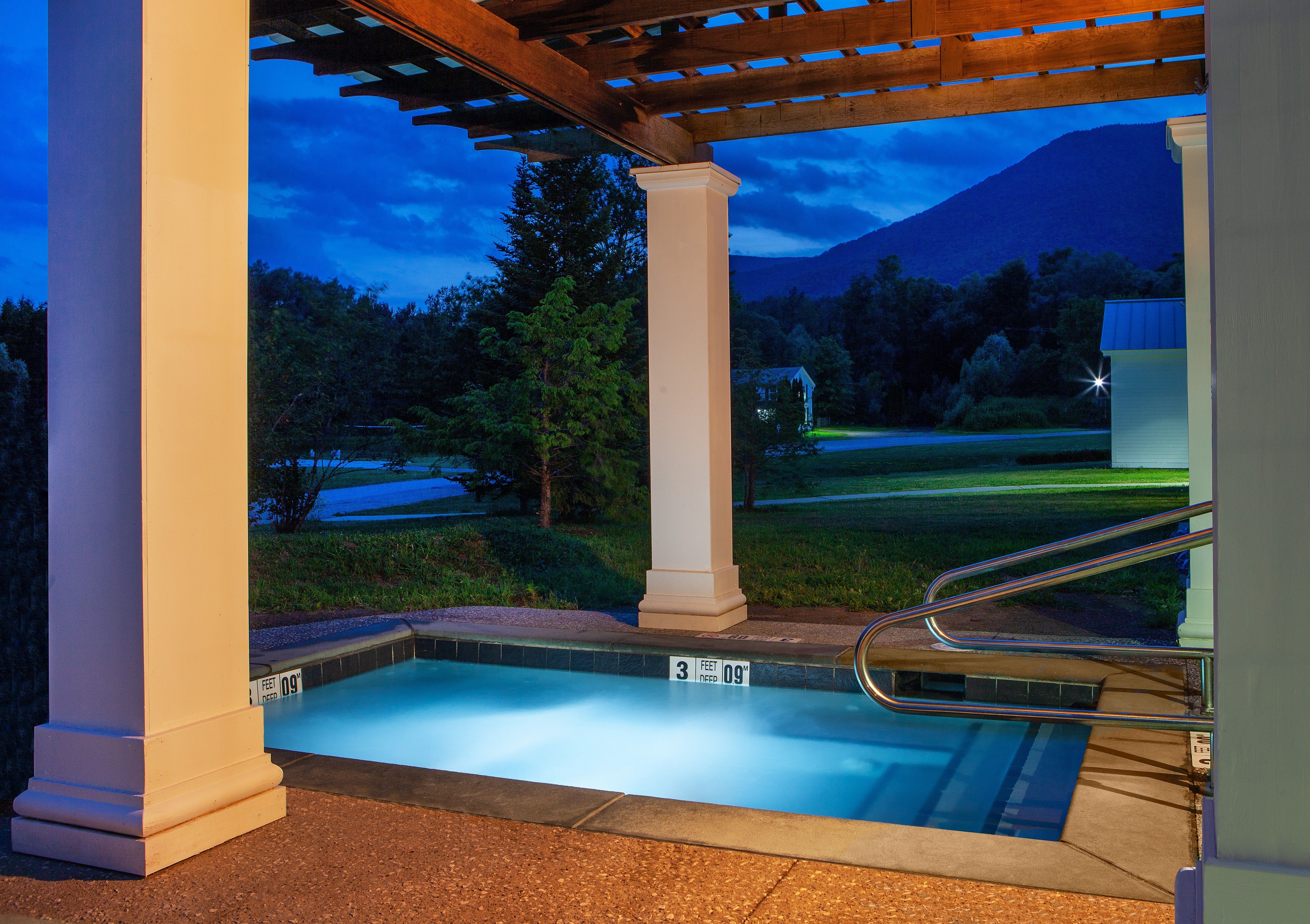 image Bask in the soothing warmth of the hot tub as the sun sets, enveloping you in tranquility.