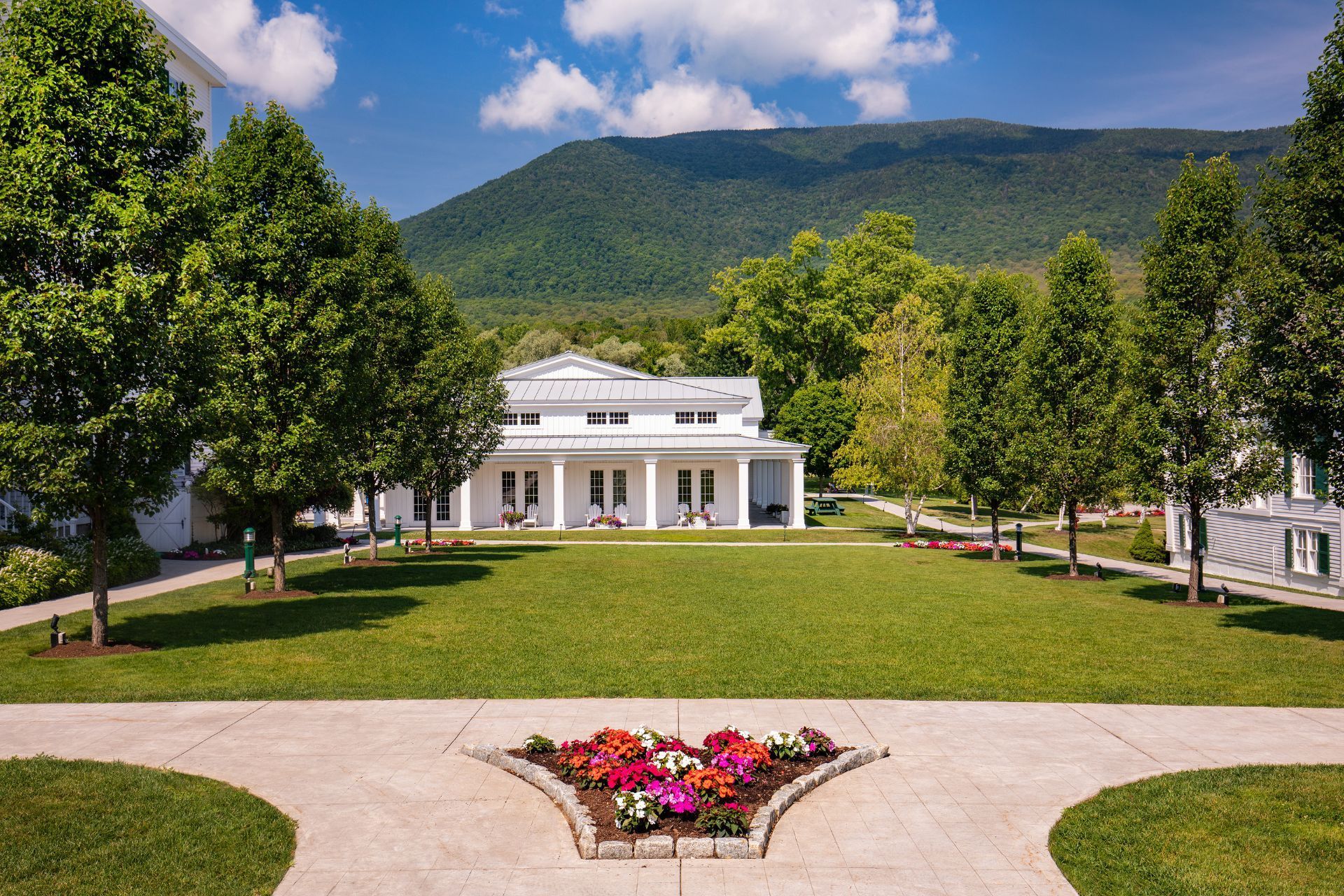 image Relax in lush gardens with vibrant flowers, set against the majestic mountains calling for adventure.