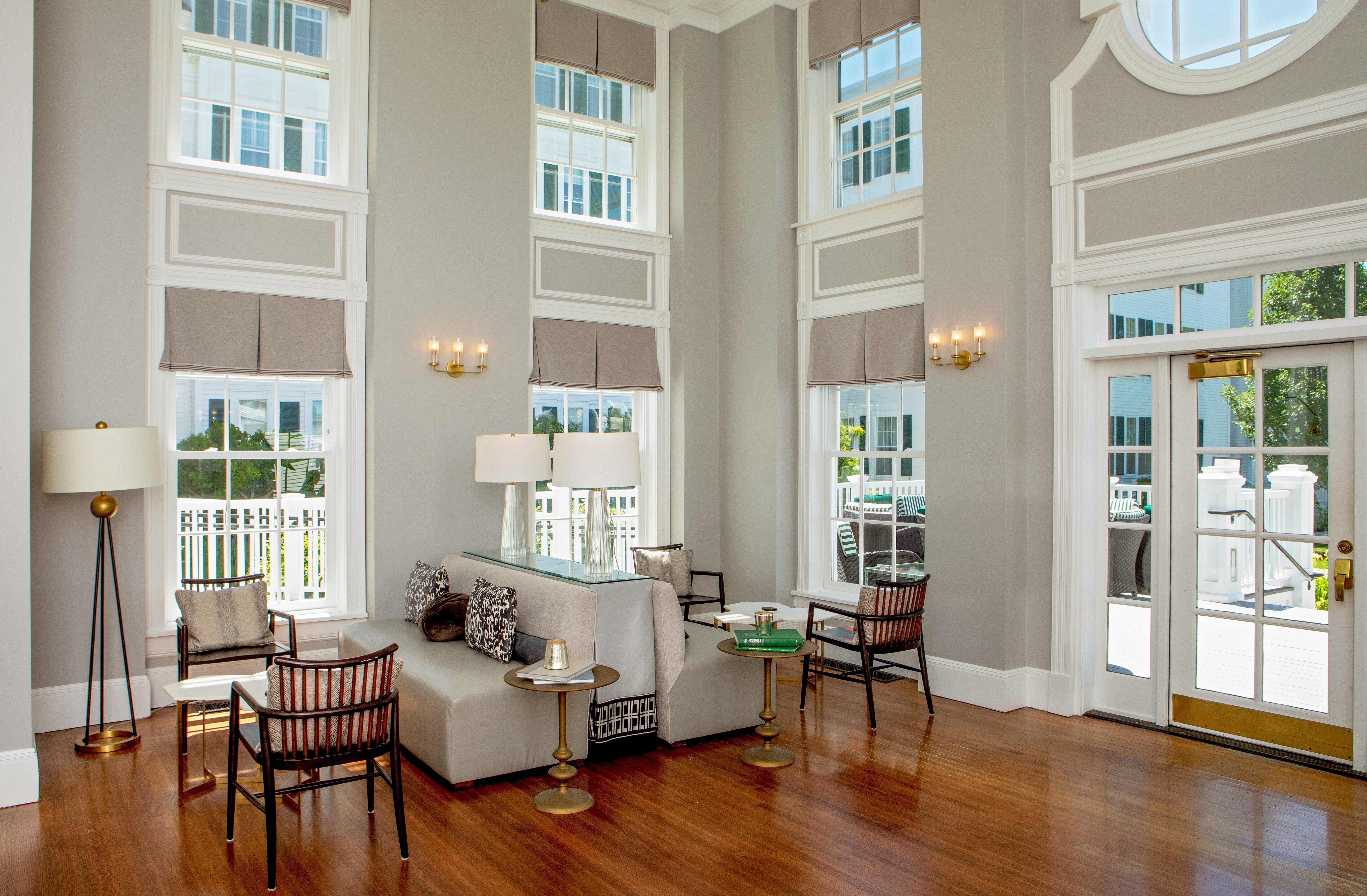 image Unwind in this stylish lounge, boasting natural light and inviting seating for quiet moments.
