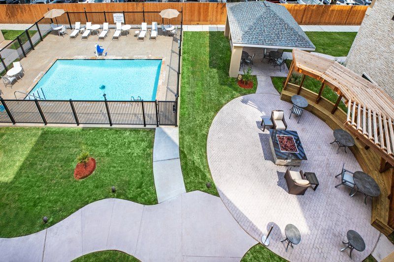 image Dive into relaxation by the pool or enjoy a cozy evening by the fire pit.