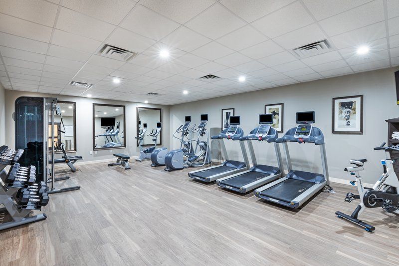 image Break a sweat with state-of-the-art fitness equipment in a bright, inviting gym space.