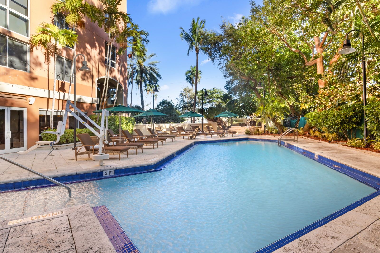 image Take a refreshing dip in the inviting pool, just steps away from shaded lounge areas.